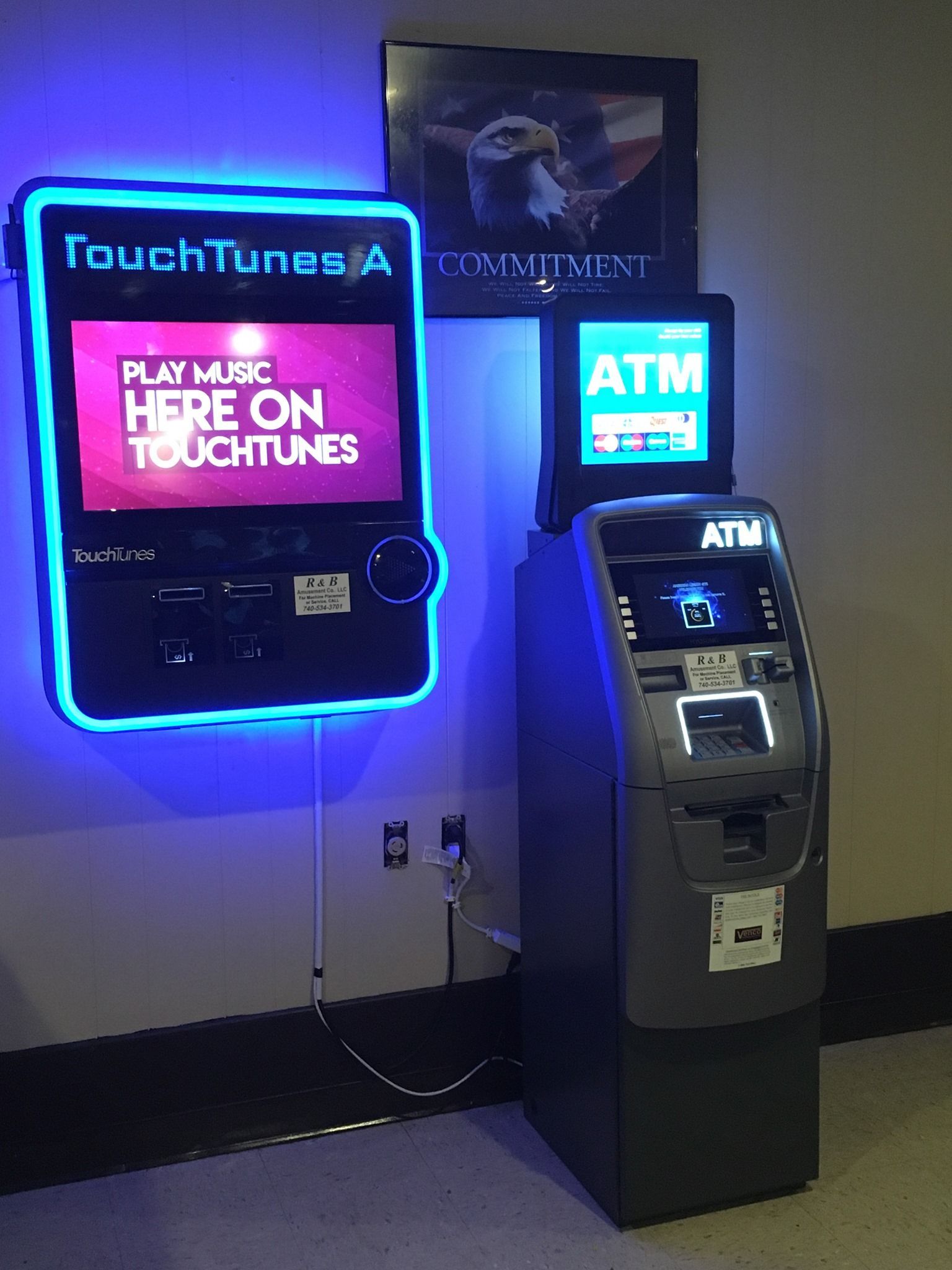 A person's hand pressing buttons on an ATM.