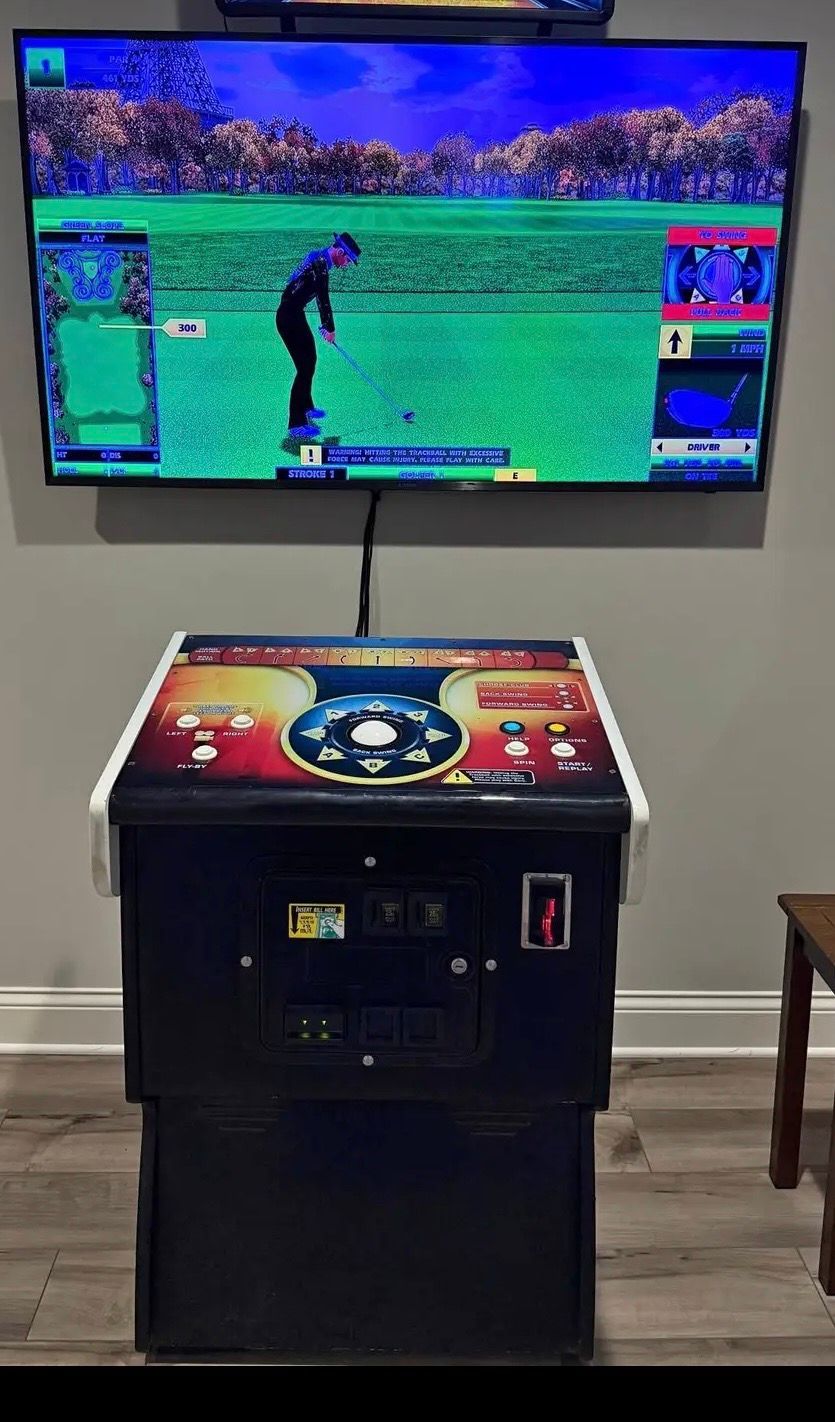 Person in a suit reaching into the vending machine to retrieve a purchased item.