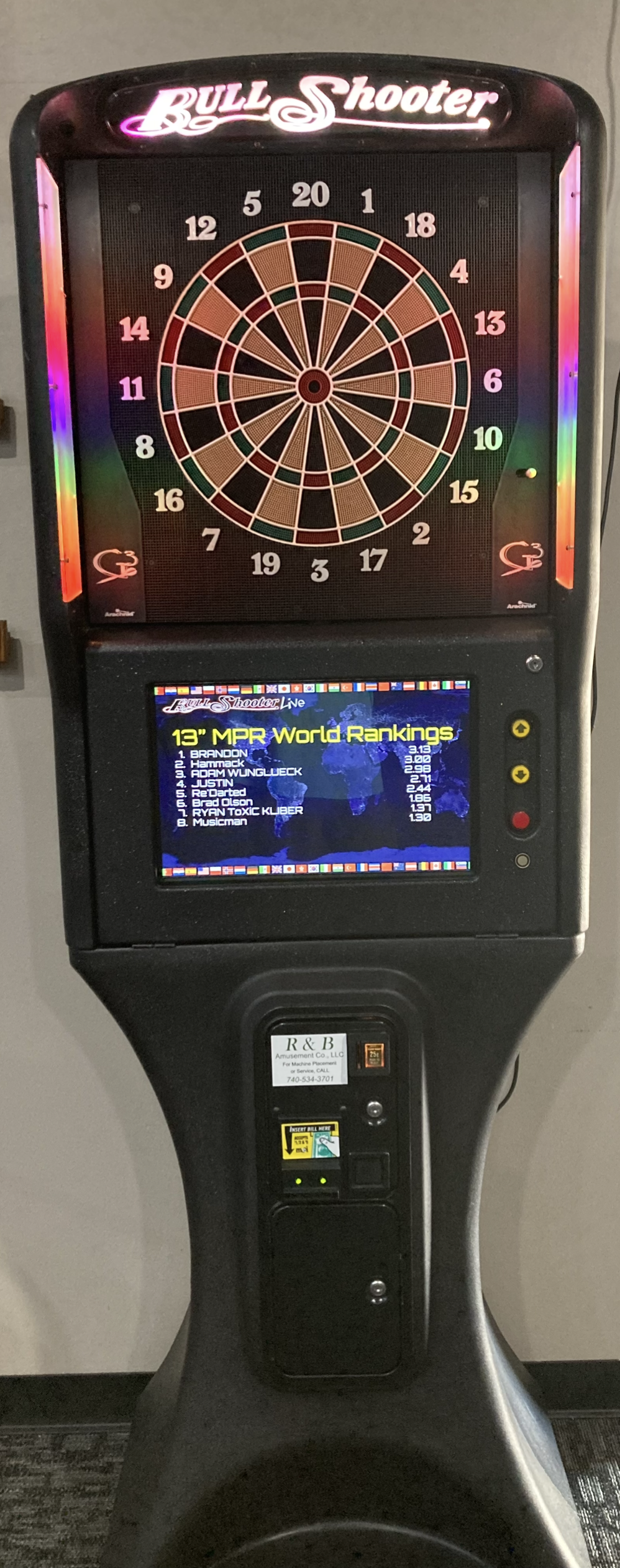 Person holding coins near a vending machine, likely deciding what to buy.