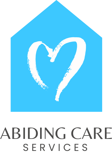 The logo for abiding care services shows a house with a heart drawn inside of it.