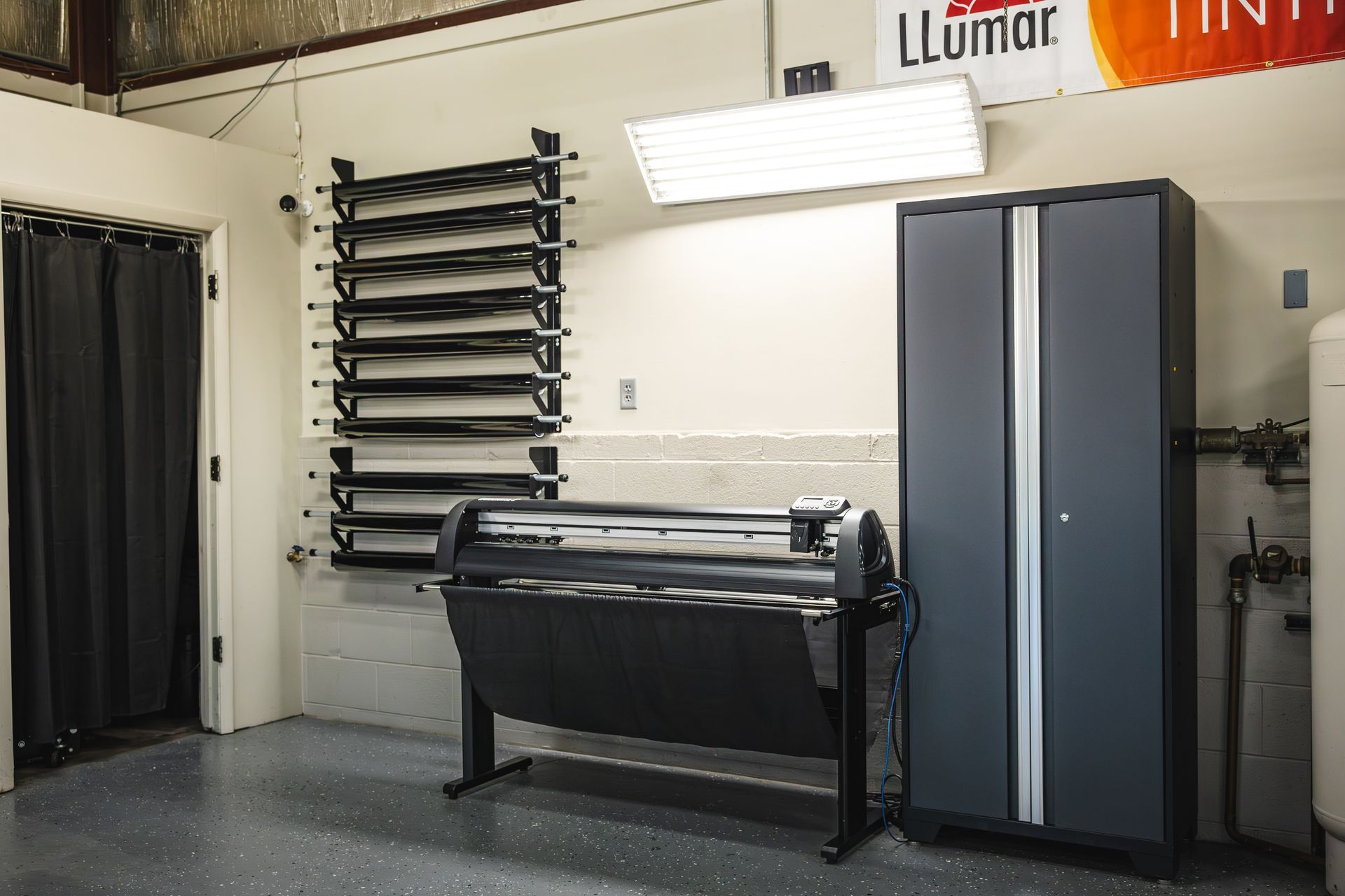 A black range rover sport is parked in a garage.