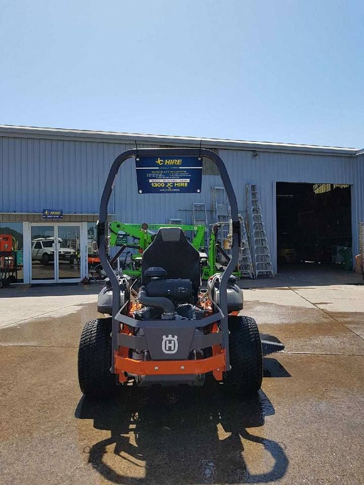 Orange Mower Parked Outside a Workshop — JC Hire In Bli Bli, QLD