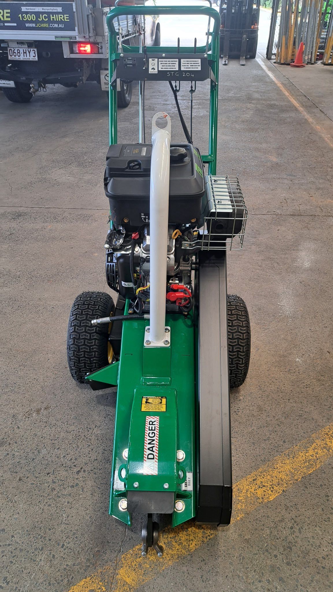 Green Wheeled Machine With a Large Black Blade — JC Hire In Bli Bli, QLD