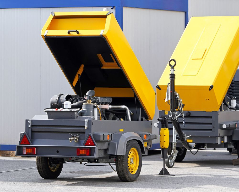 Two Yellow And Gray Trailers With Their Hoods Open — JC Hire In Maroochydore, QLD