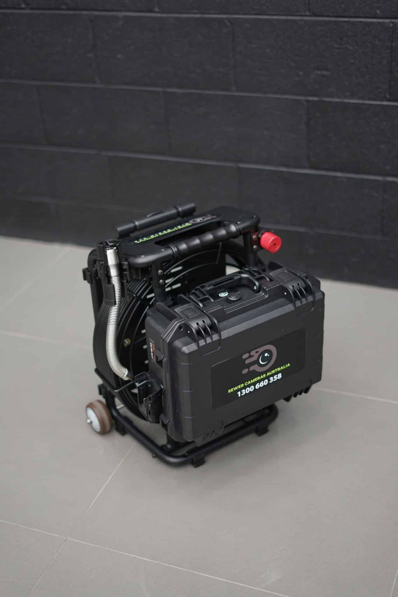 Black Tech Case With Screen and Keypad, Mounted on Wheels in an Indoor Setting — JC Hire in Bli Bli, QLD