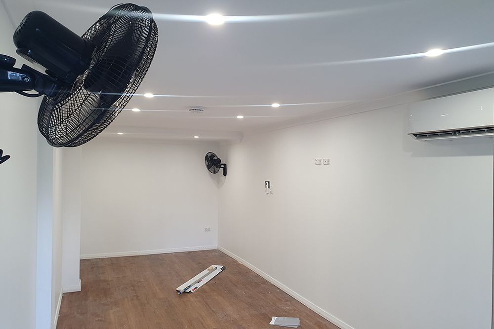 Room with fan and wirings — Electricians in Palmerston, NT