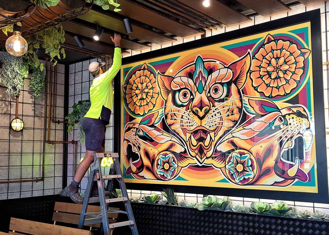 Man fixing the spotlight — Electricians in Palmerston, NT