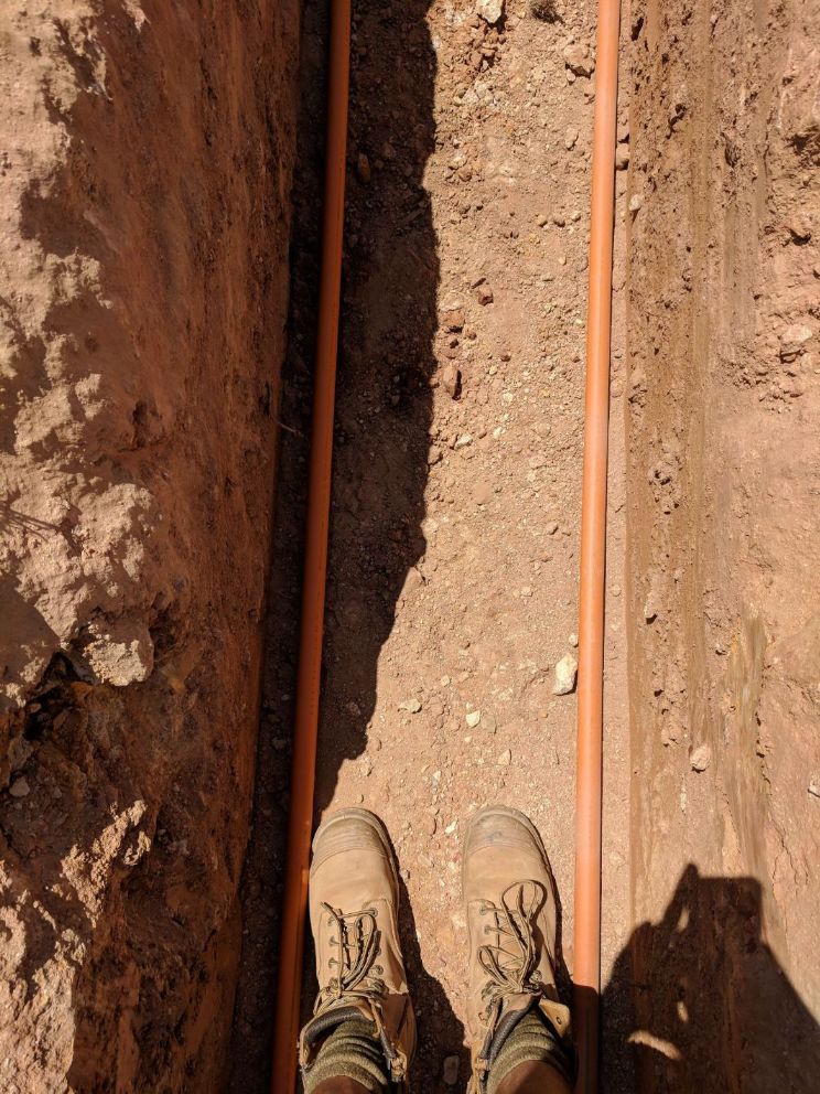 Orange PVC Pipes 3 — Electricians in Palmerston, NT