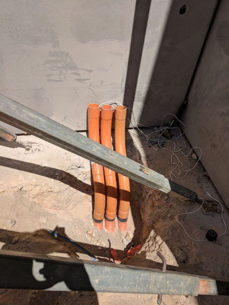 Orange PVC Pipes 2 — Electricians in Palmerston, NT