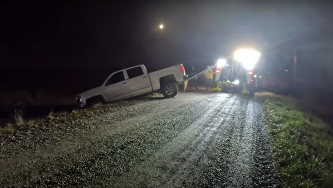 Removing stuck vehicle in preparation for towing, recovery and salvage
