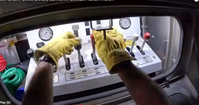Towing operator using the winch console for flatbed vehicle recovery