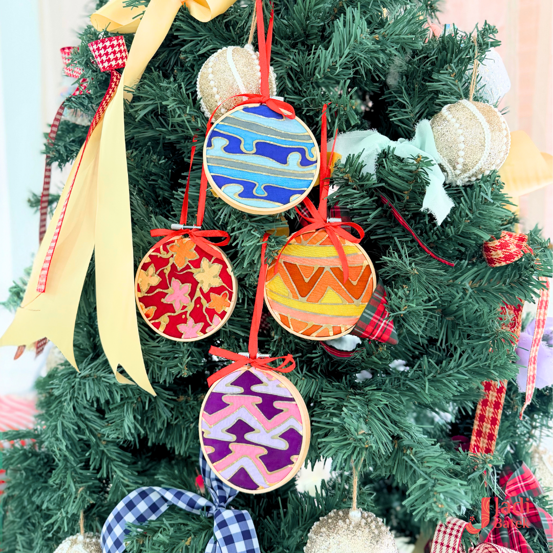 Handmade batik Christmas ornaments hanging on a decorated Christmas tree at Jadi Batek