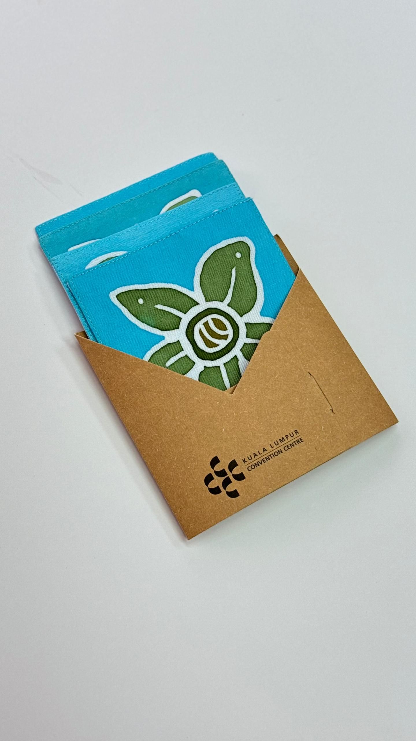 Eco-friendly packaging for handmade batik card using recycled kraft paper sleeve