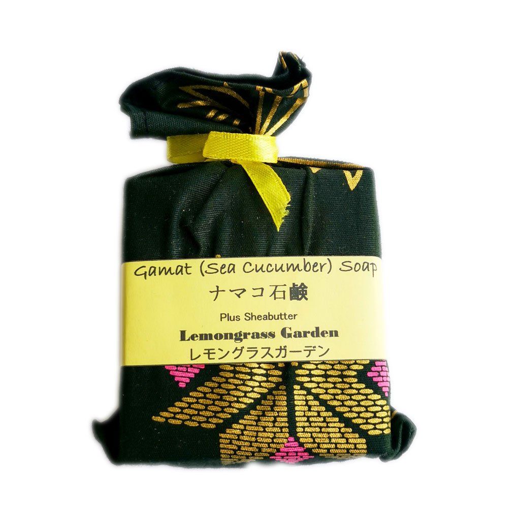 Soap bar wrapped in black fabric with yellow label.