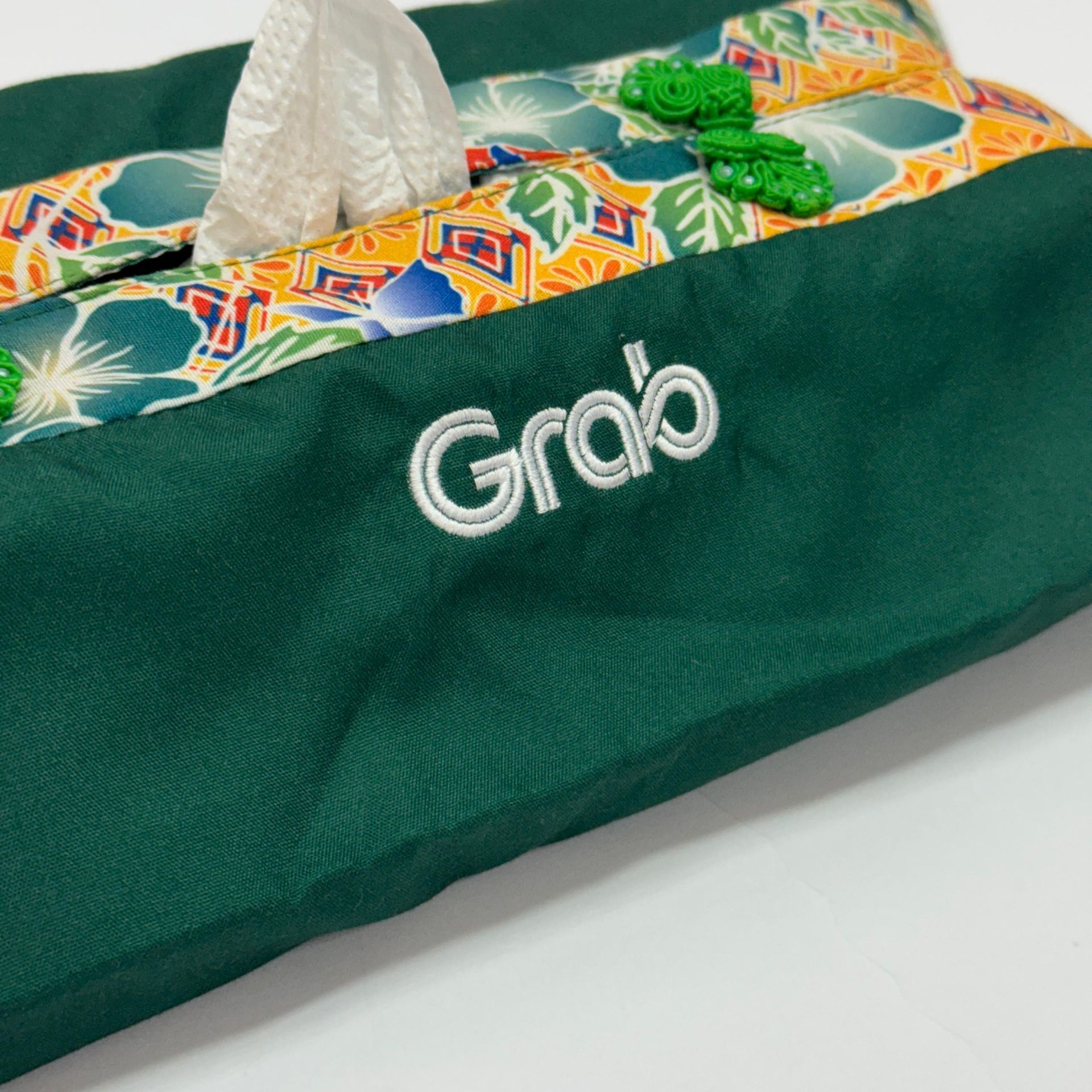 Custom embroidered logo on batik product for corporate orders