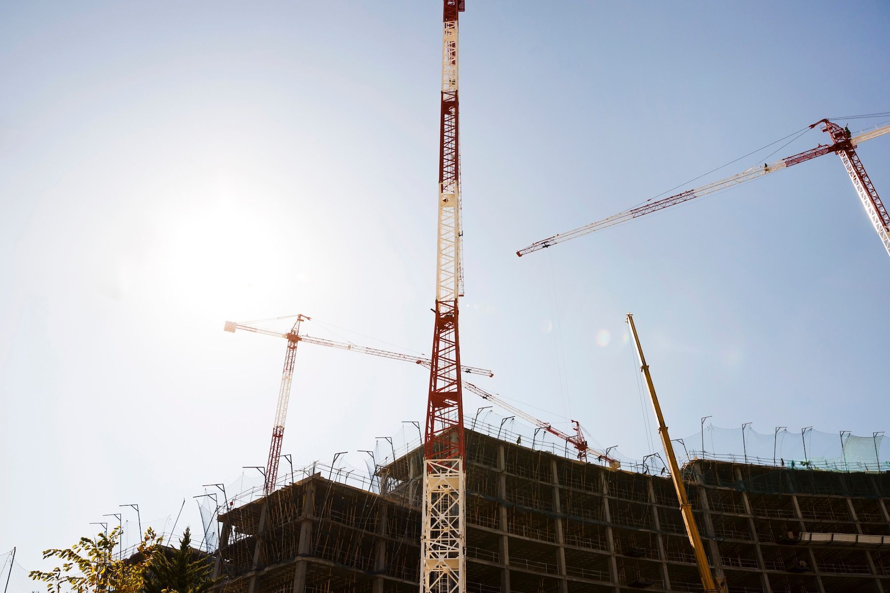 A construction site with cranes and a sign that says ' a ' on it