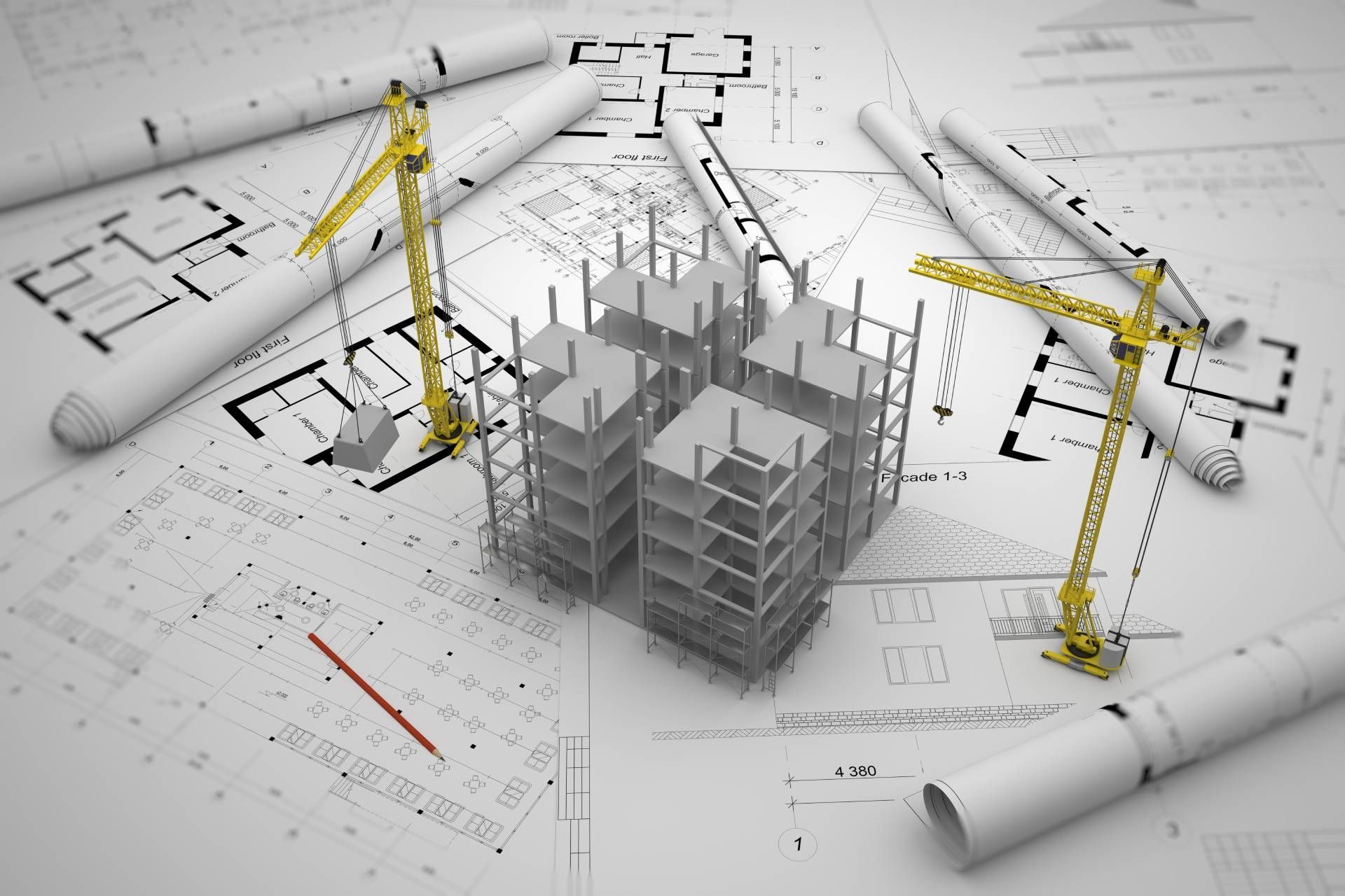 A model of a building under construction is surrounded by blueprints