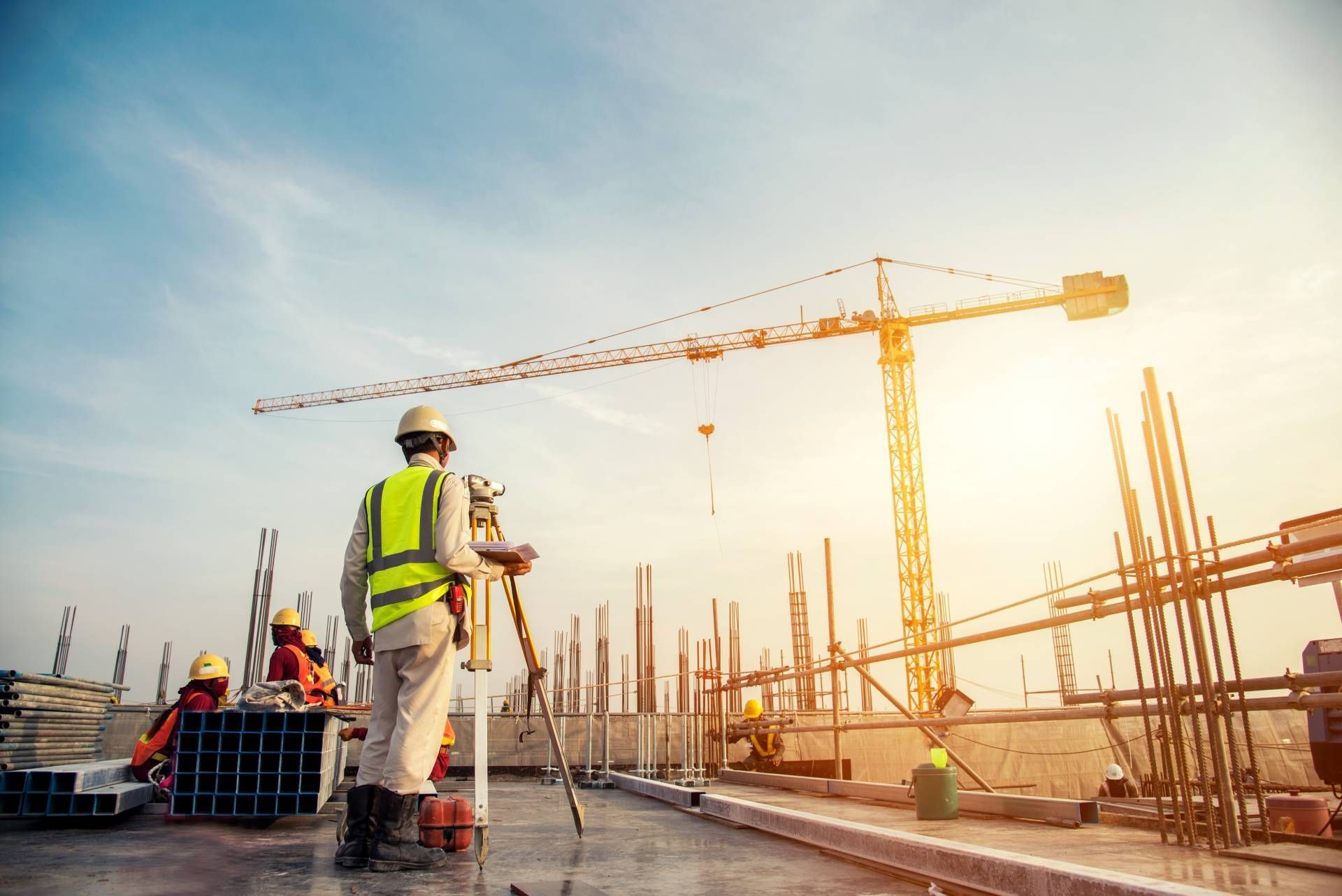 A group of construction workers are working on a building under construction.