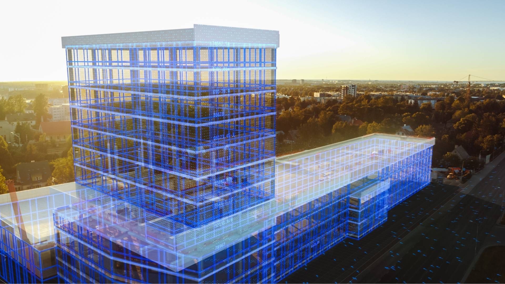 An aerial view of a large building in the middle of a city.