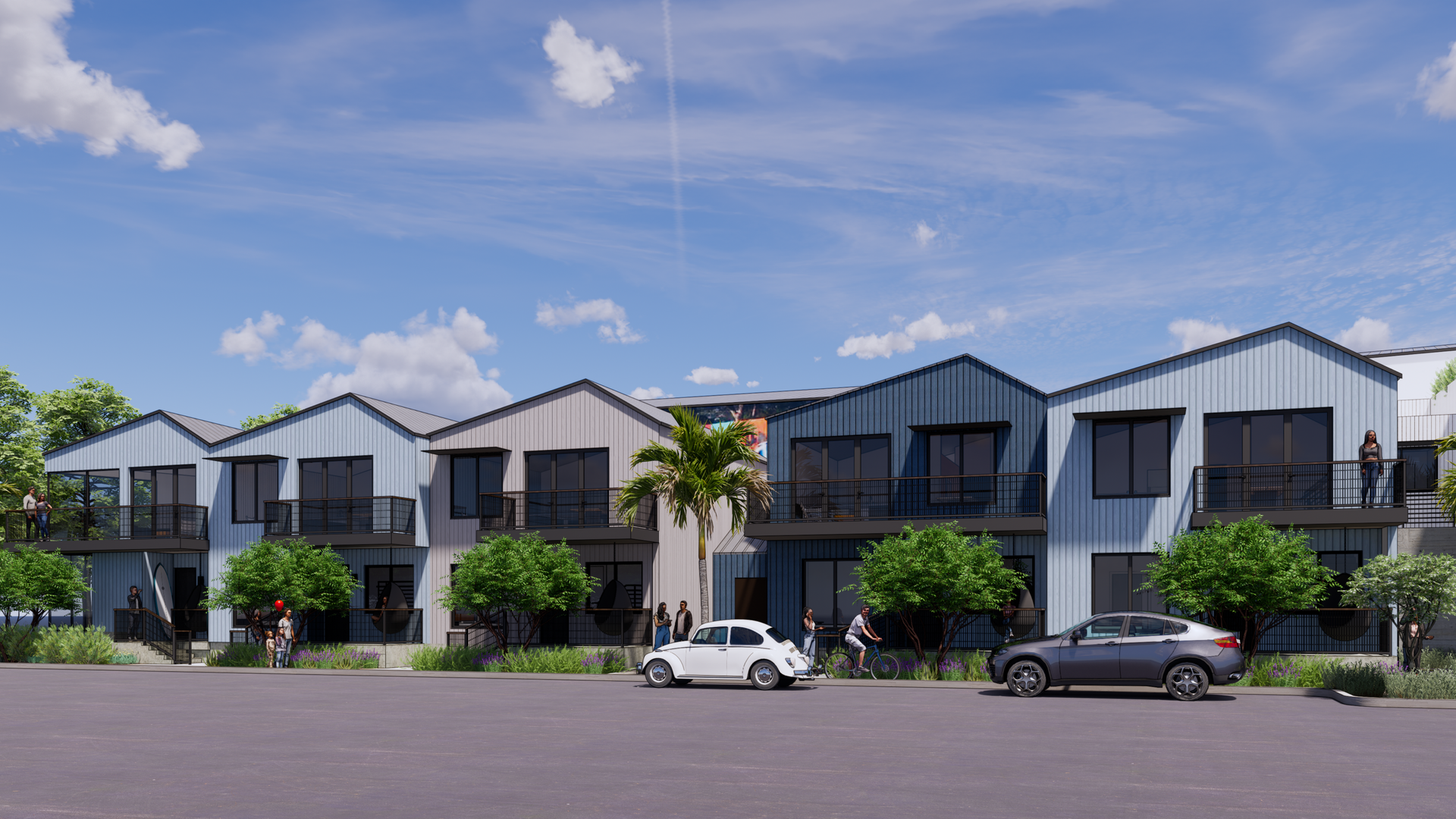 Row of modern townhouses with blue and gray siding, balconies, palm tree, cars, and clear sky.