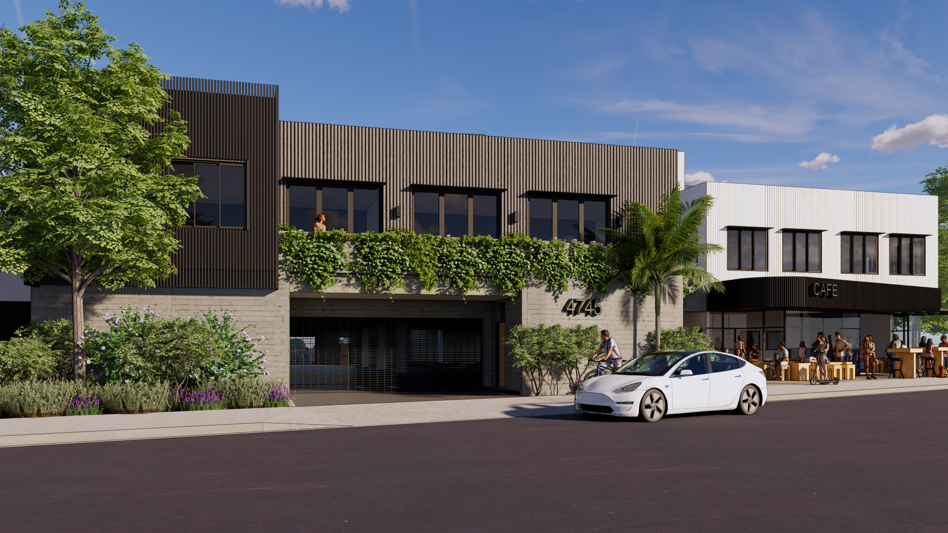 Exterior view of a modern building with a restaurant/cafe, featuring a car parked out front and sidewalk seating.