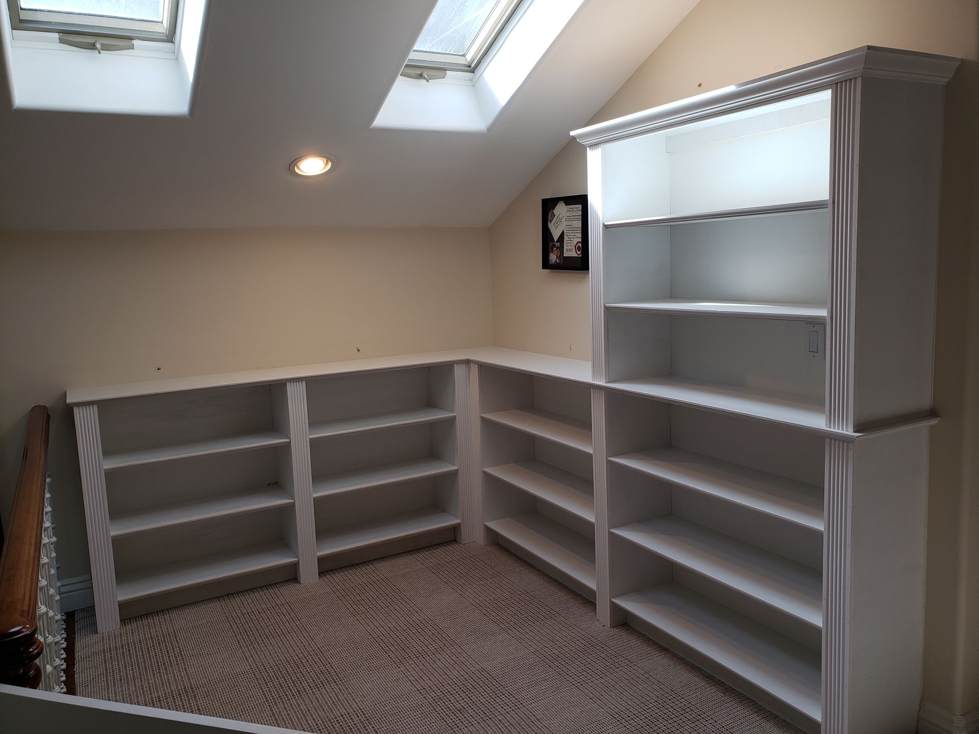 Person installing a door handle on a light-colored wooden door.