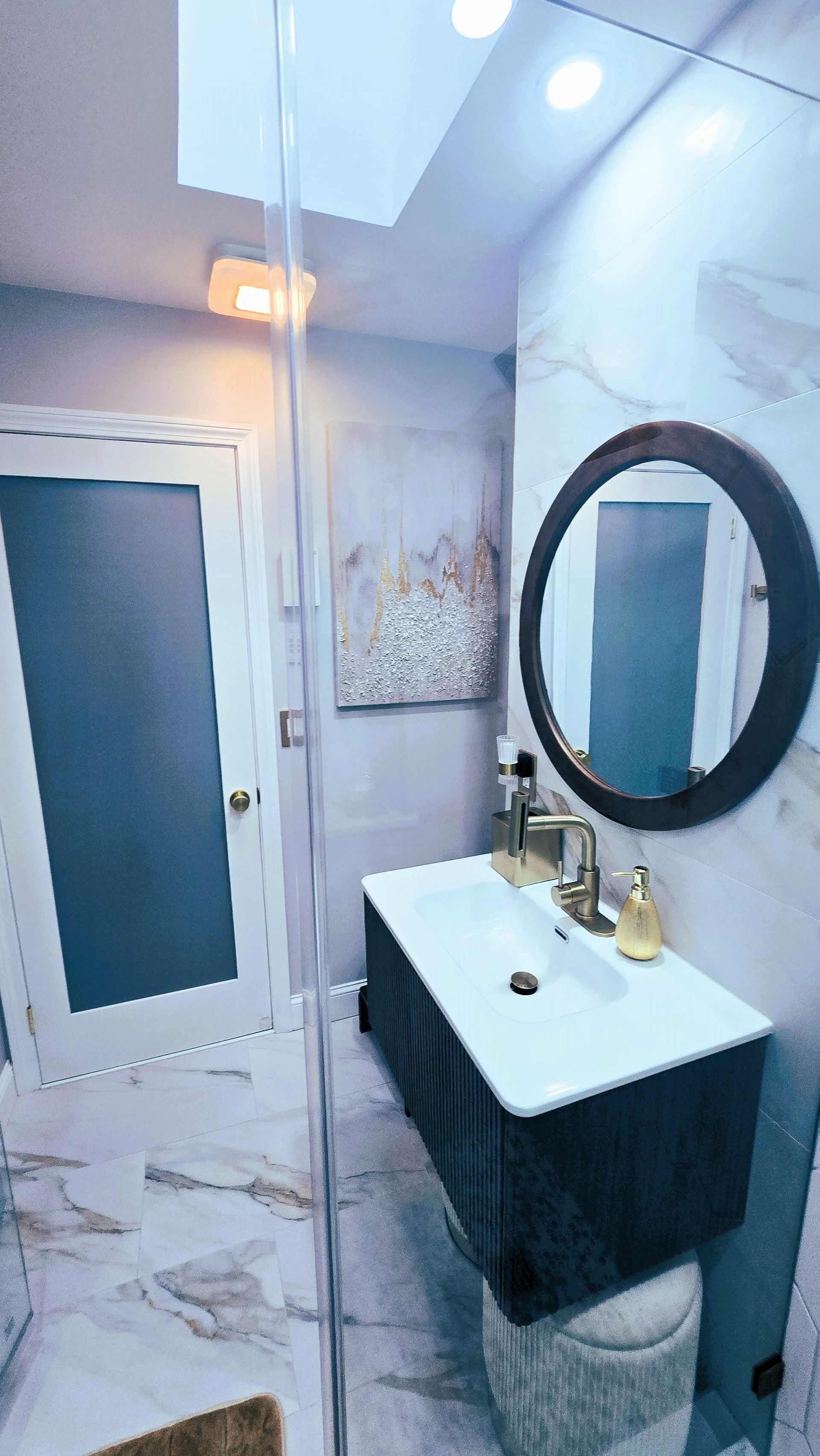 A bathroom with a sink , toilet , and mirror.