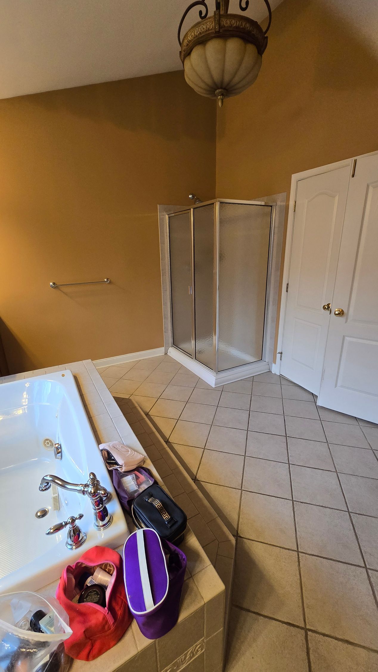 A bathroom with a bathtub and a shower head