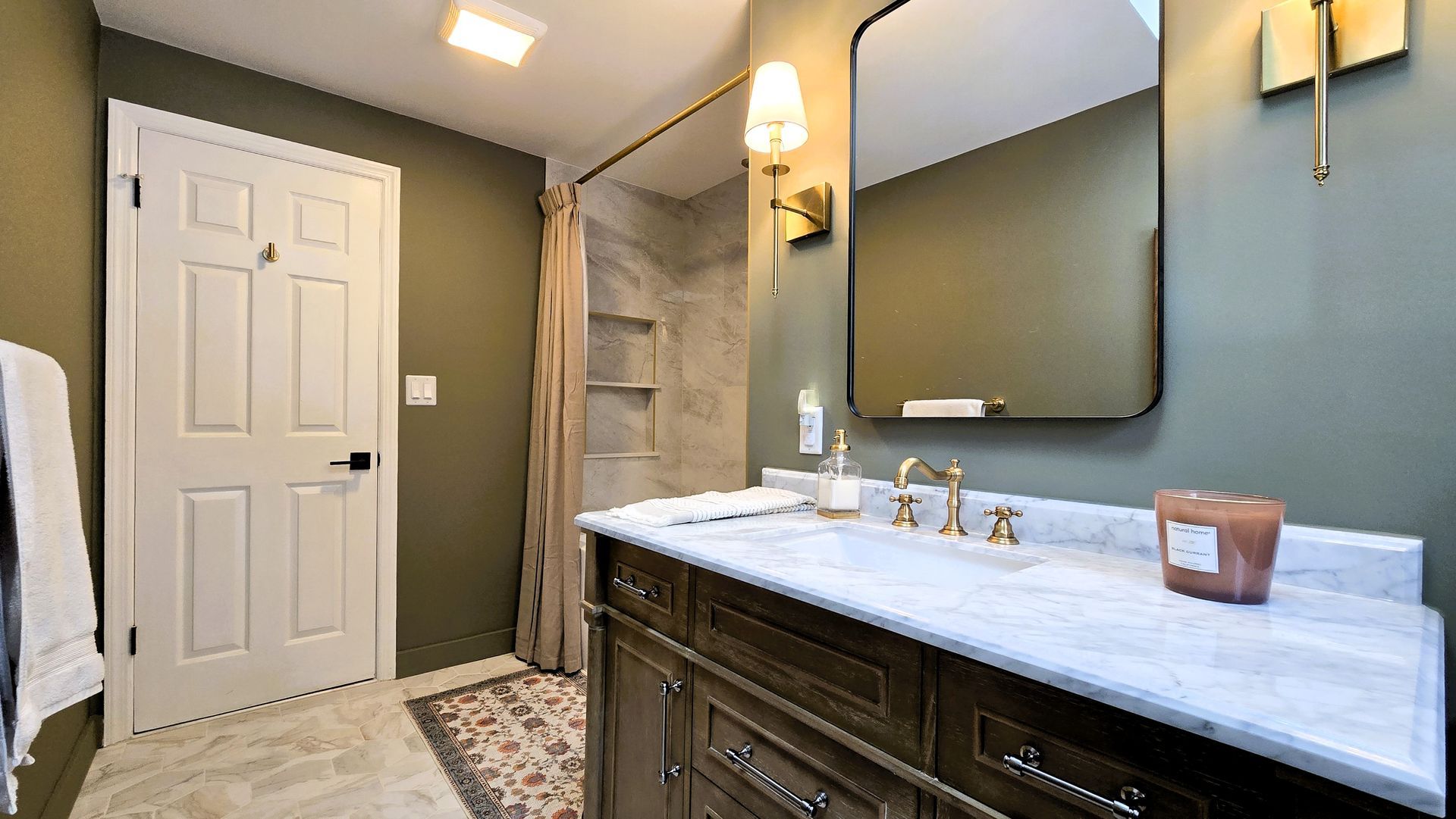 A before and after photo of a bathroom remodel.