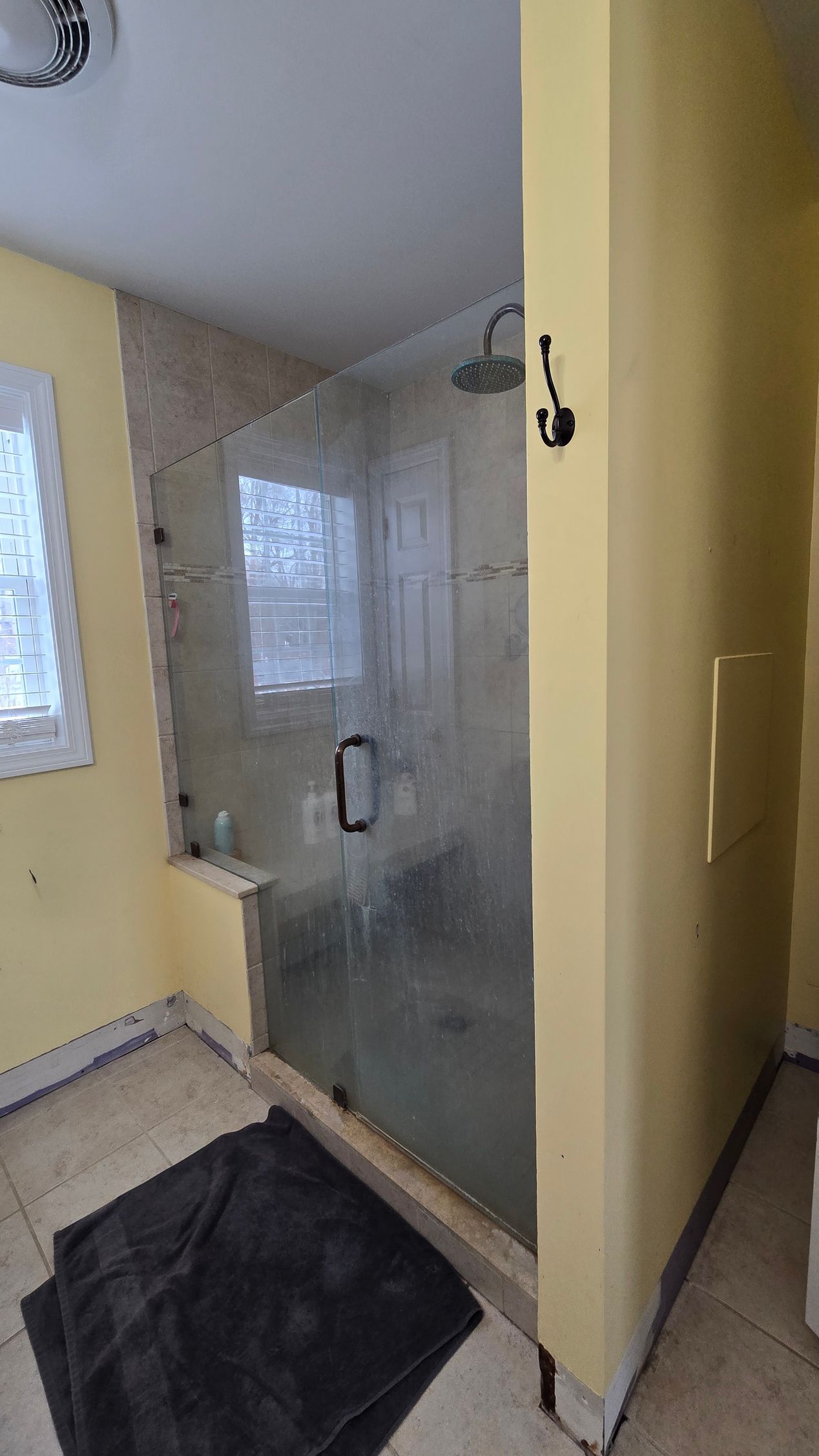 A bathroom with a bathtub and a shower.