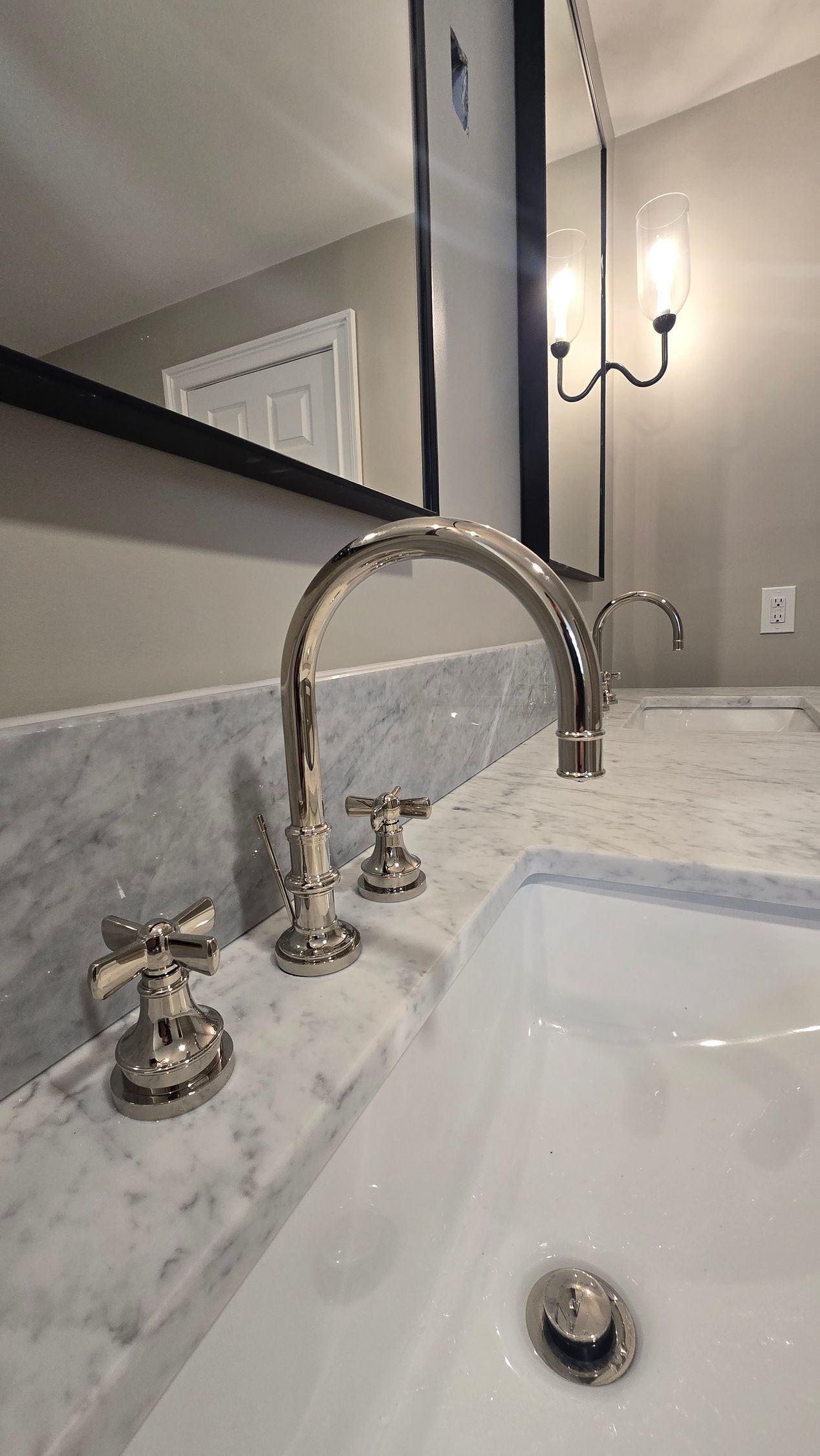 A bathroom with a red jacuzzi tub and a skylight.