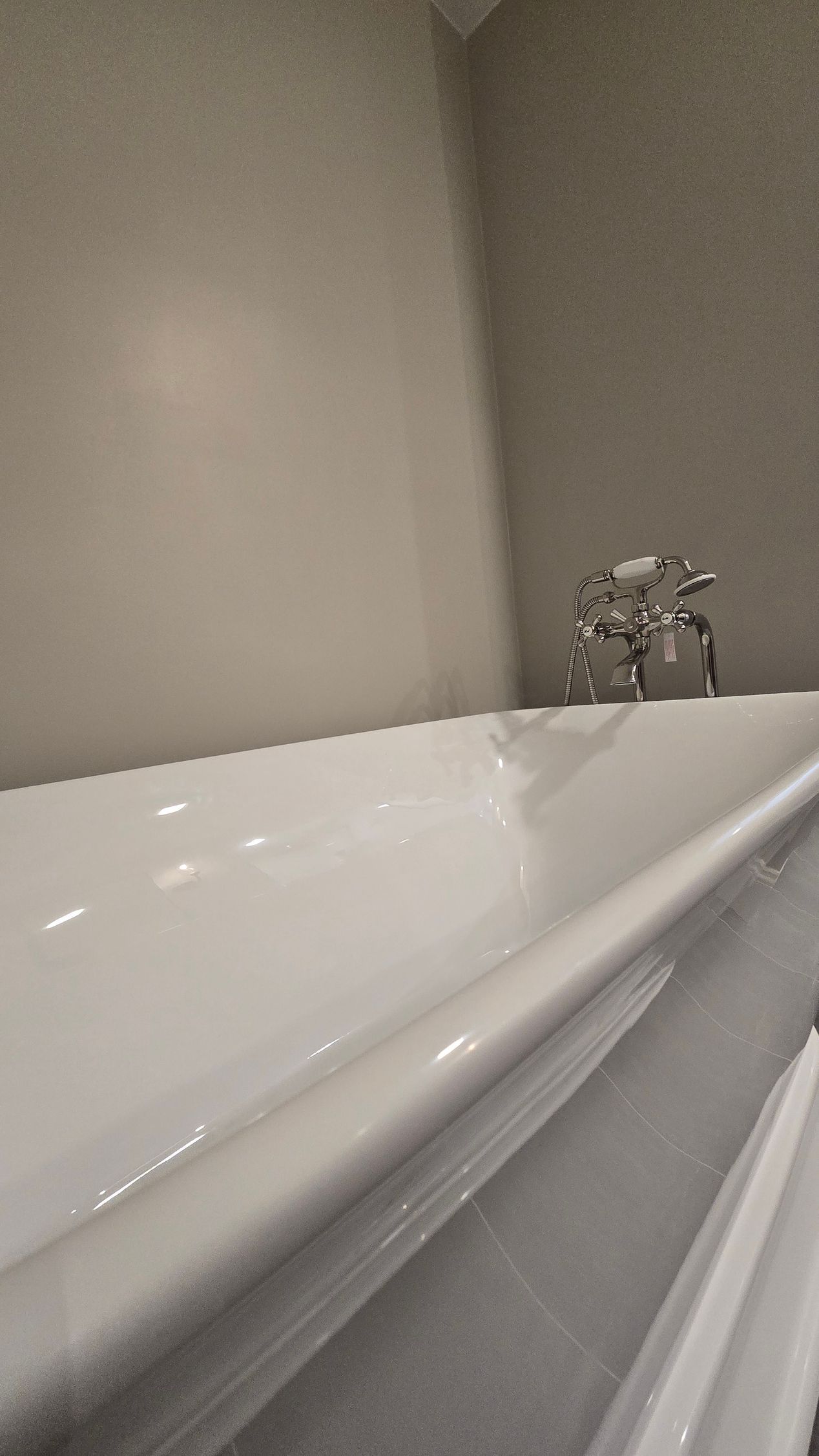 A bathroom with a red jacuzzi tub in the corner
