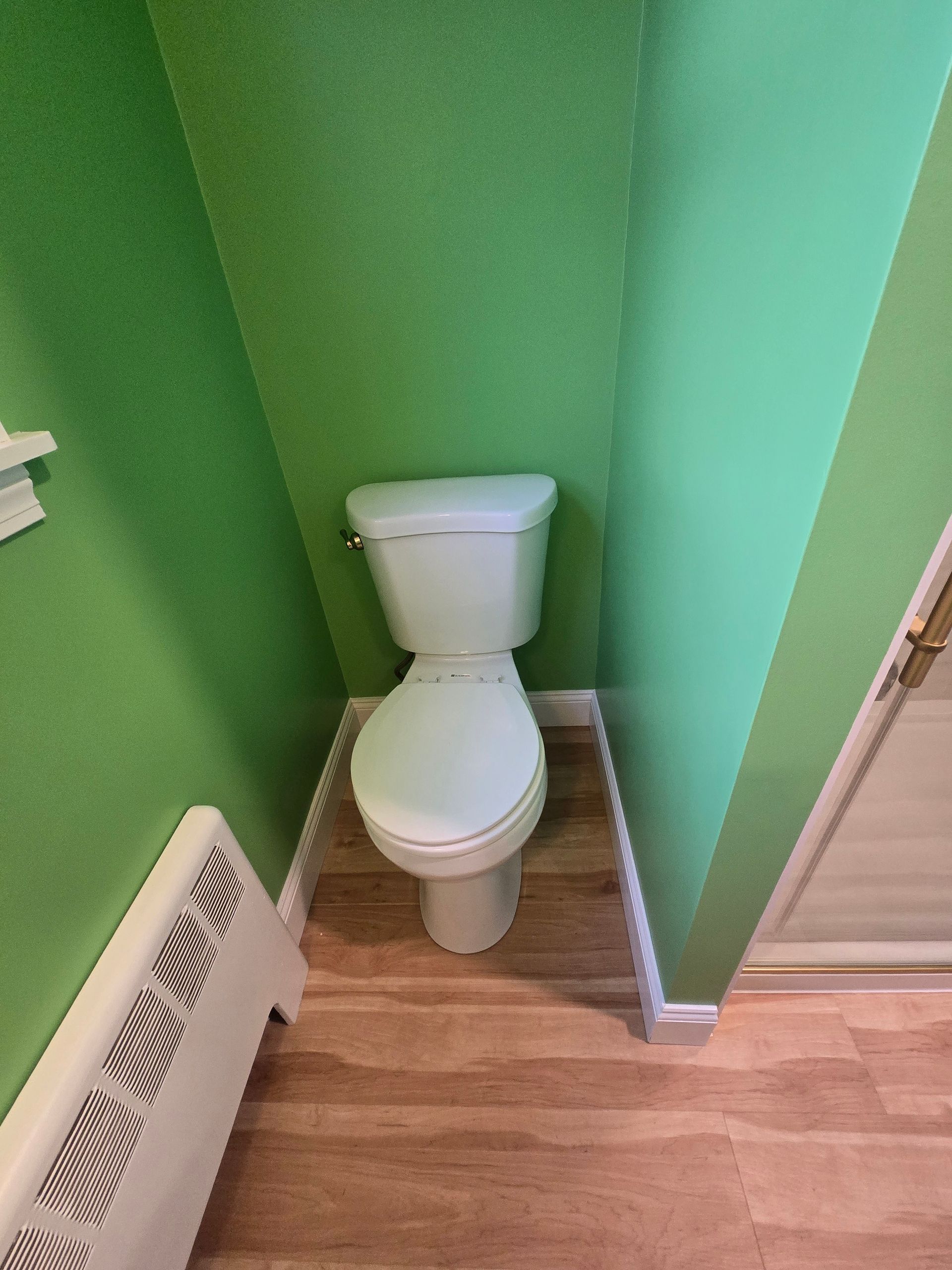 A shower with a built in shelf and a shower head
