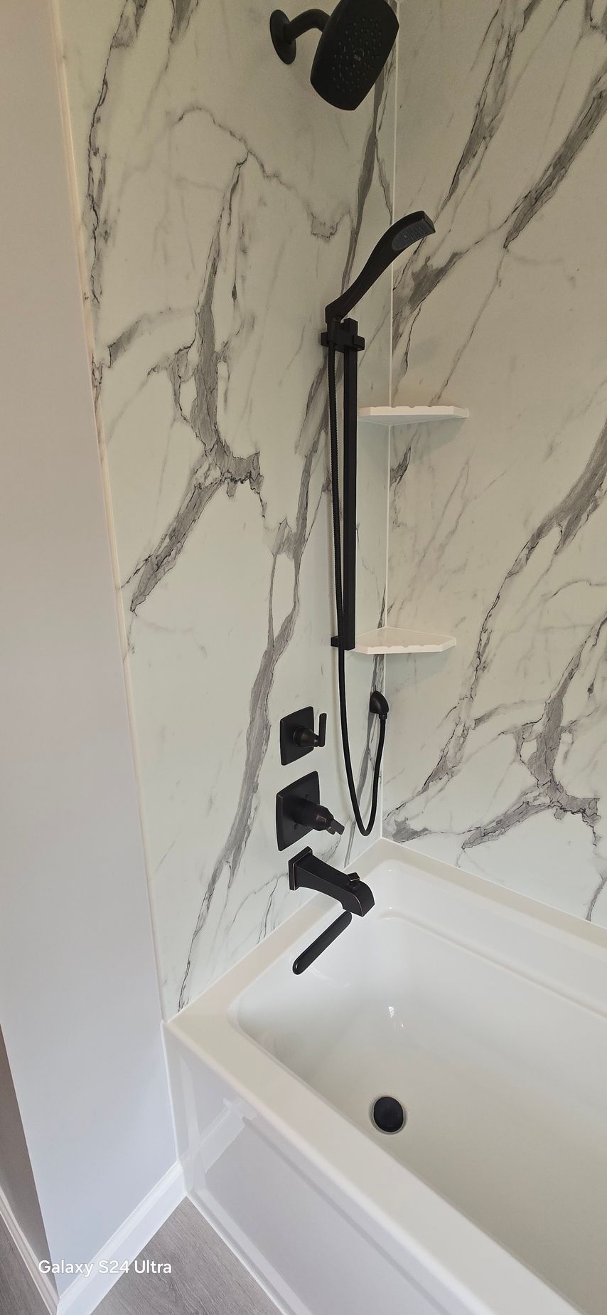 A bathroom with a sink , toilet , and window.