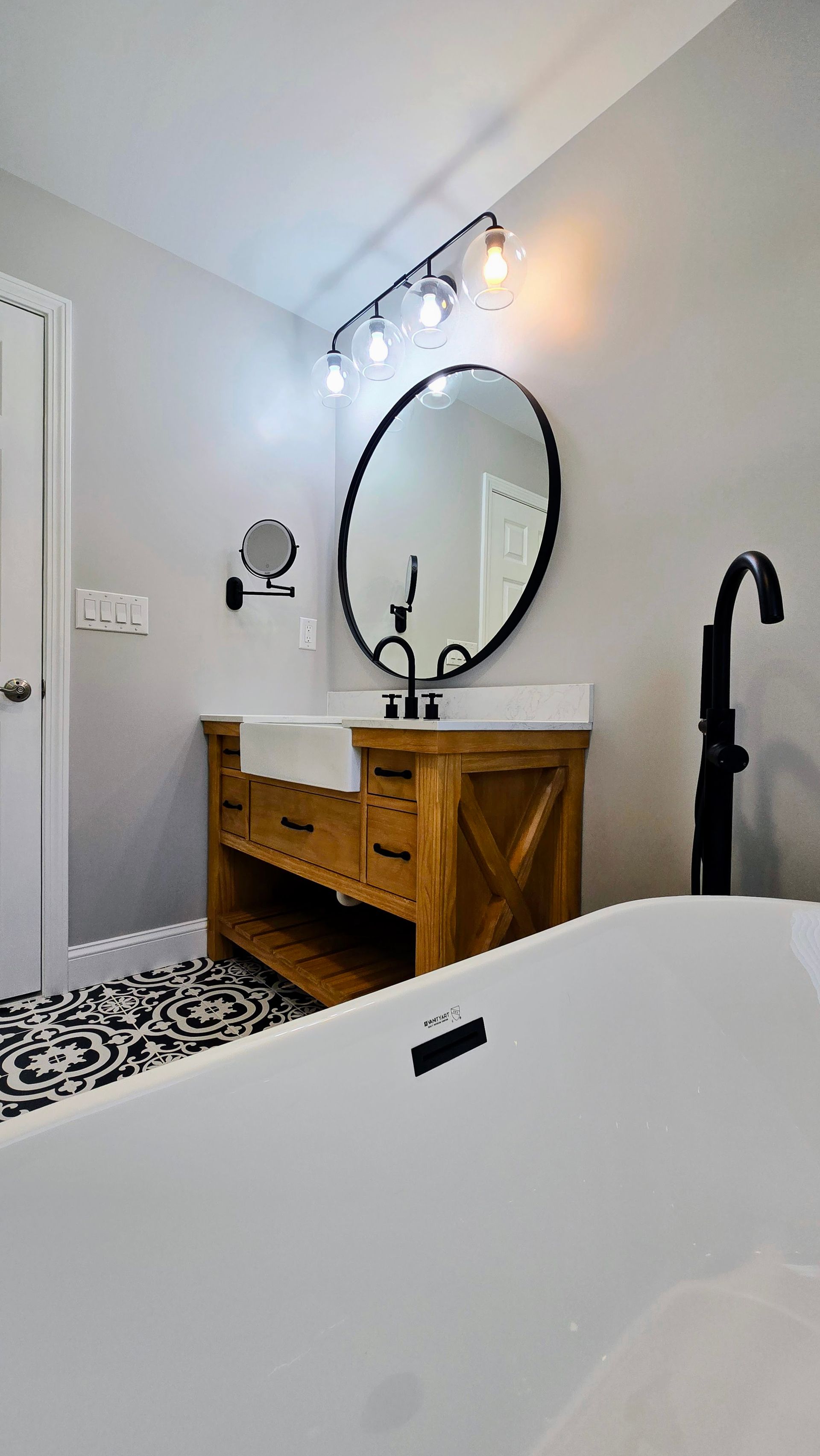 A Southington bathroom with a sink , mirror , and bathtub.