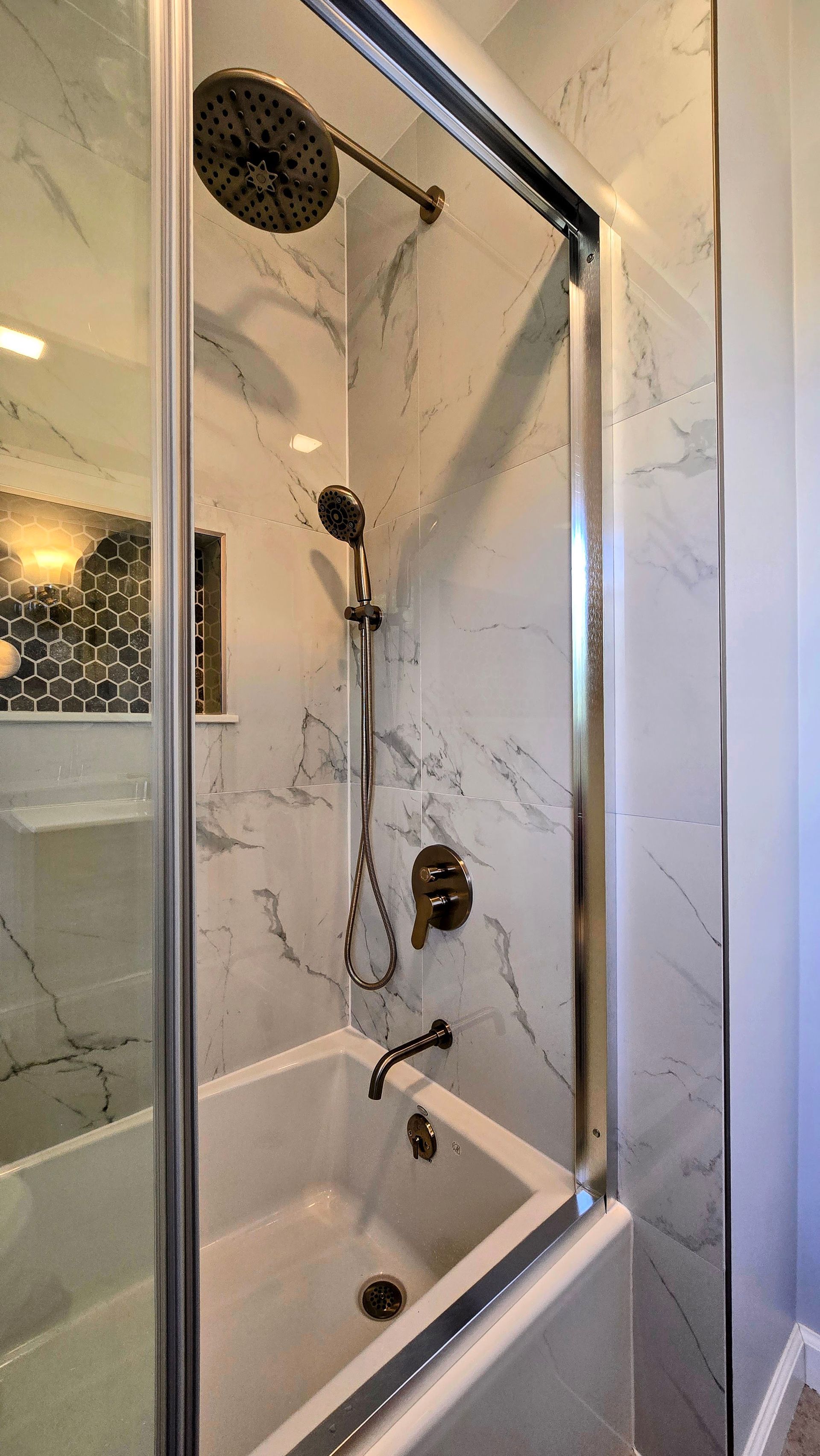 Bristol bathroom vanity with black fixtures, lit mirror, and neutral walls.