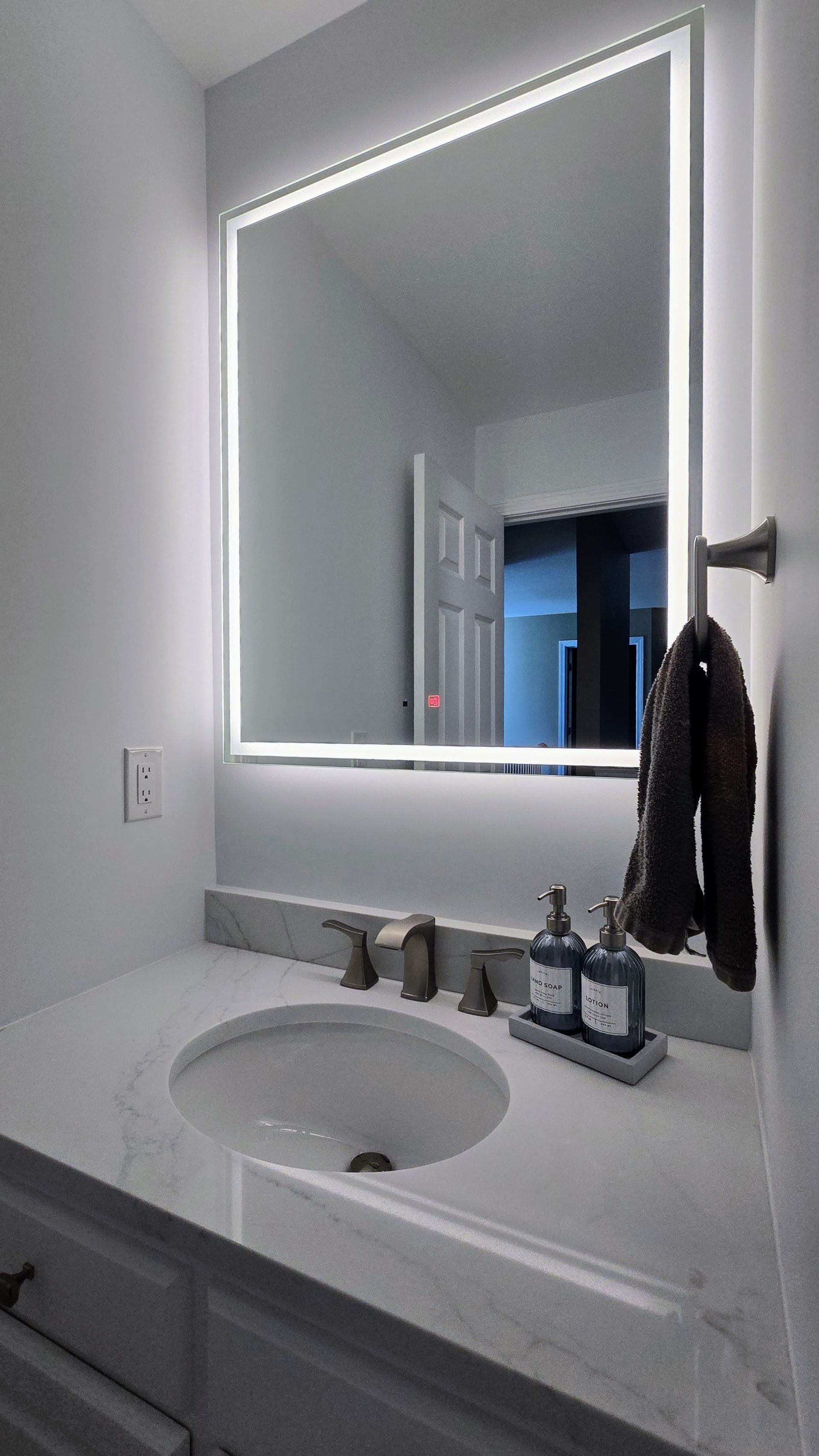 A bathroom with a bathtub and a shower head