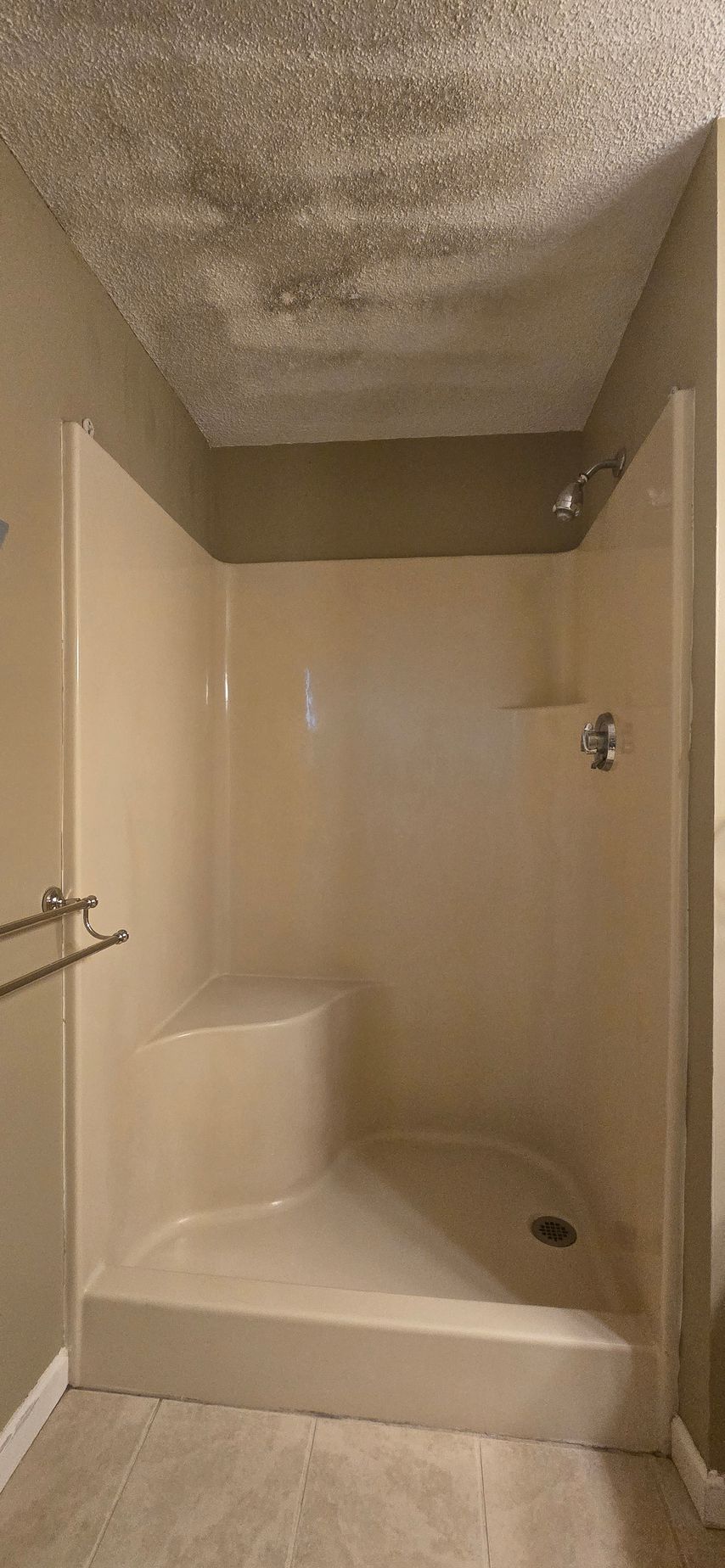 The before Bathroom remodel in Wolcott, CT with a tub, toilet, vanity, and closed door.