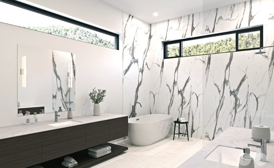 A bathroom with black and white tiles and a shower head.