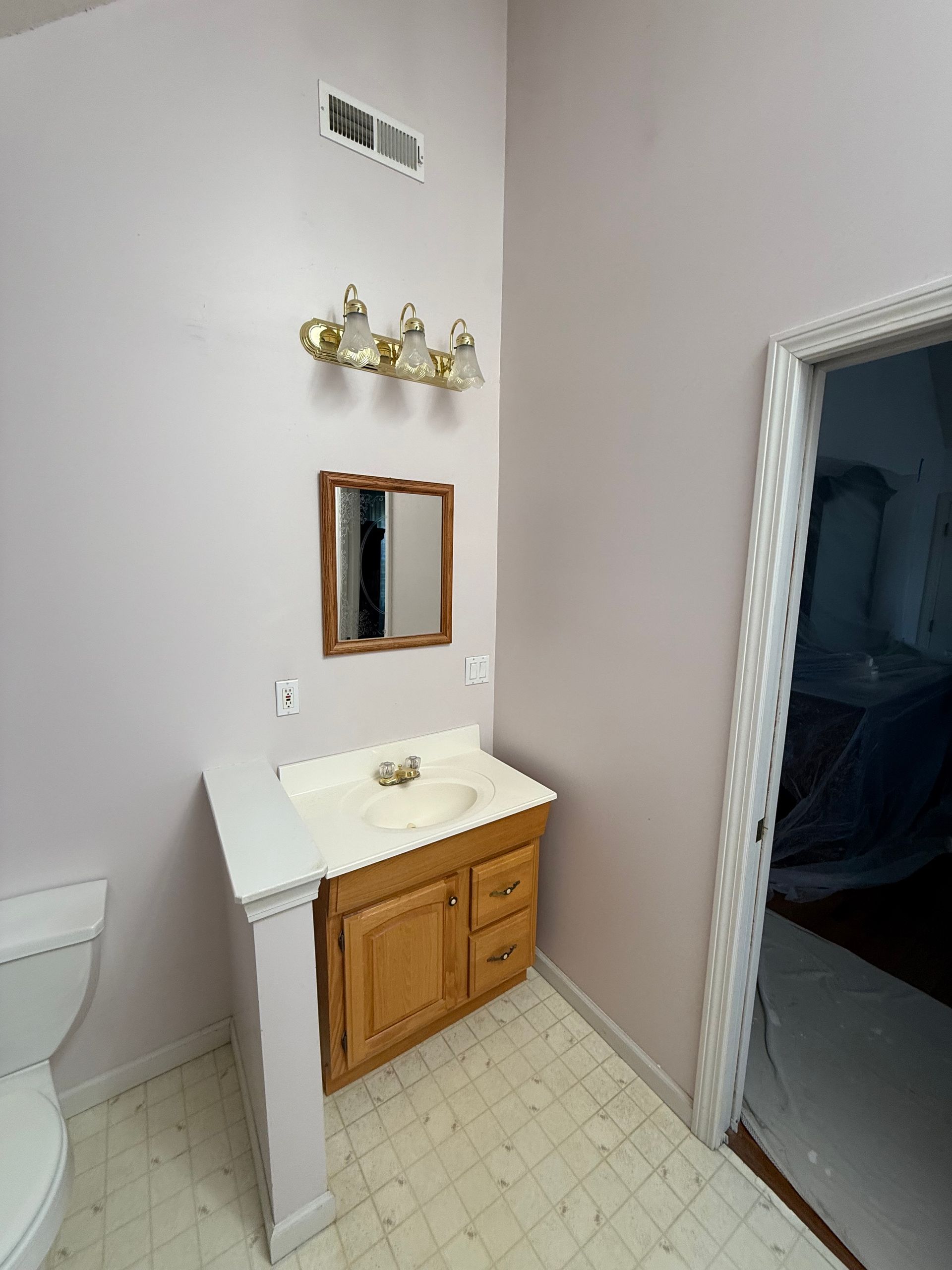 A bathroom with a bathtub and a shower head