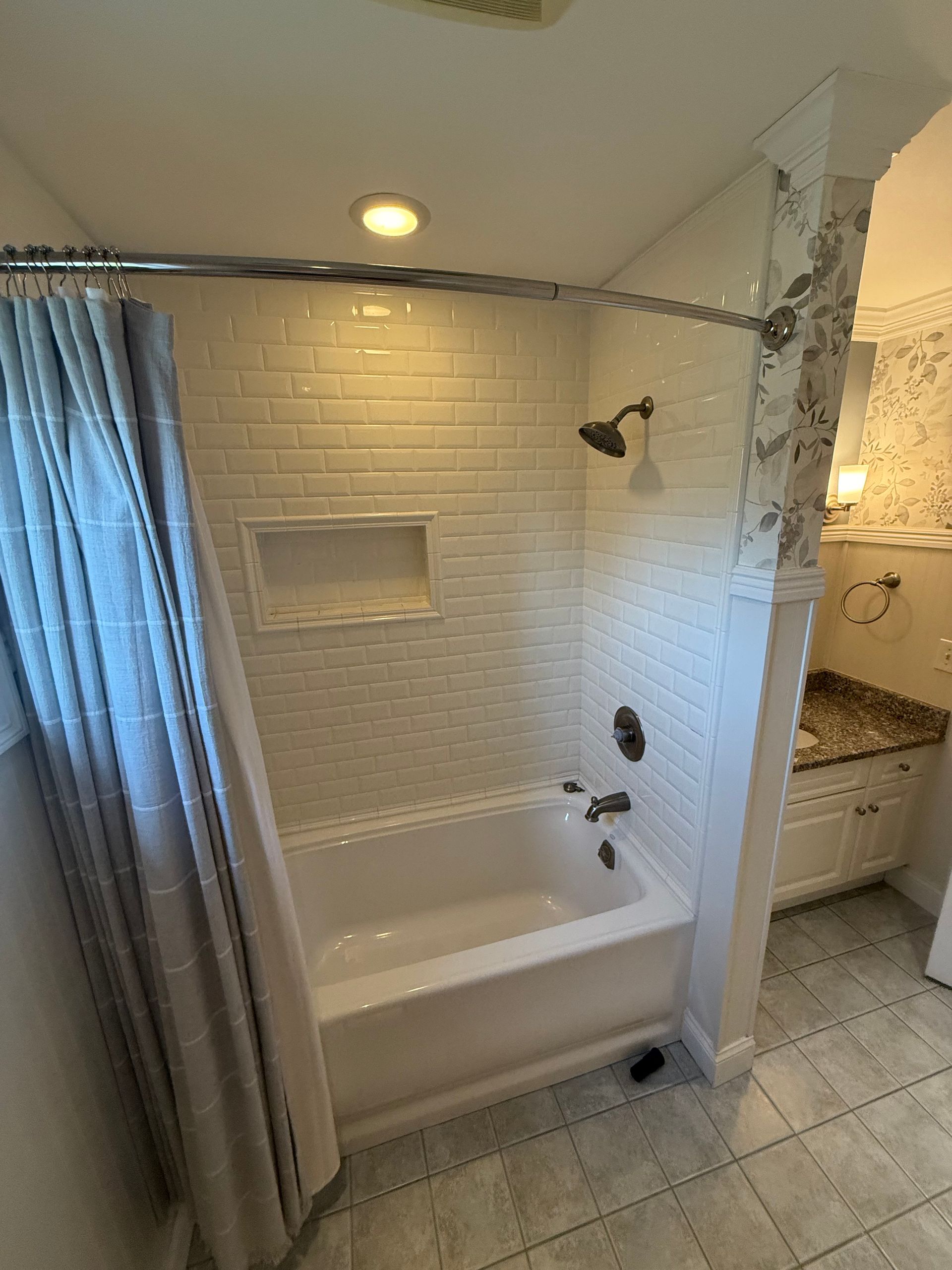 A shower stall is being built in a bathroom.