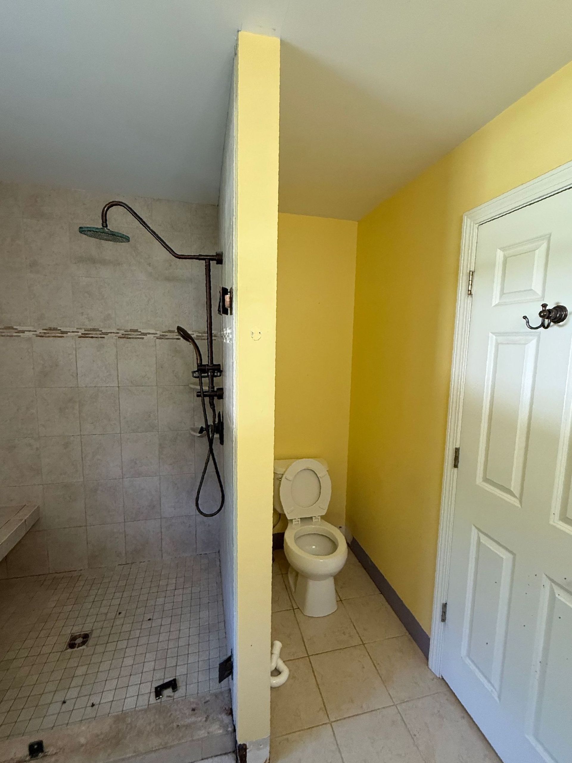 A bathroom with a jacuzzi tub , sink and mirror. Southington
