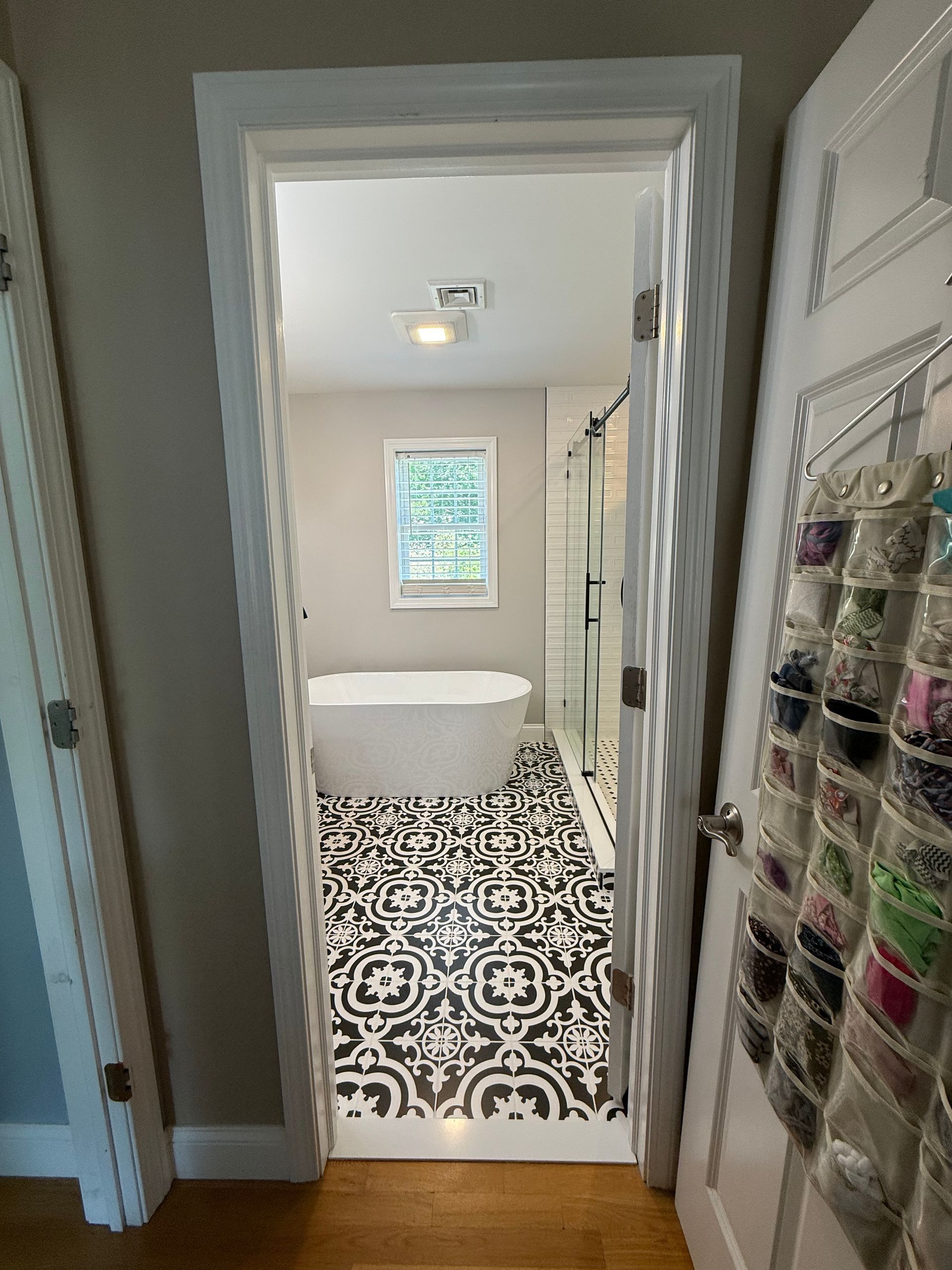A bathroom with a bathtub a toilet a sink and a mirror