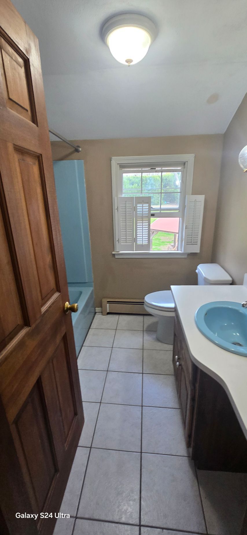 A before and after photo of a bathroom remodel.