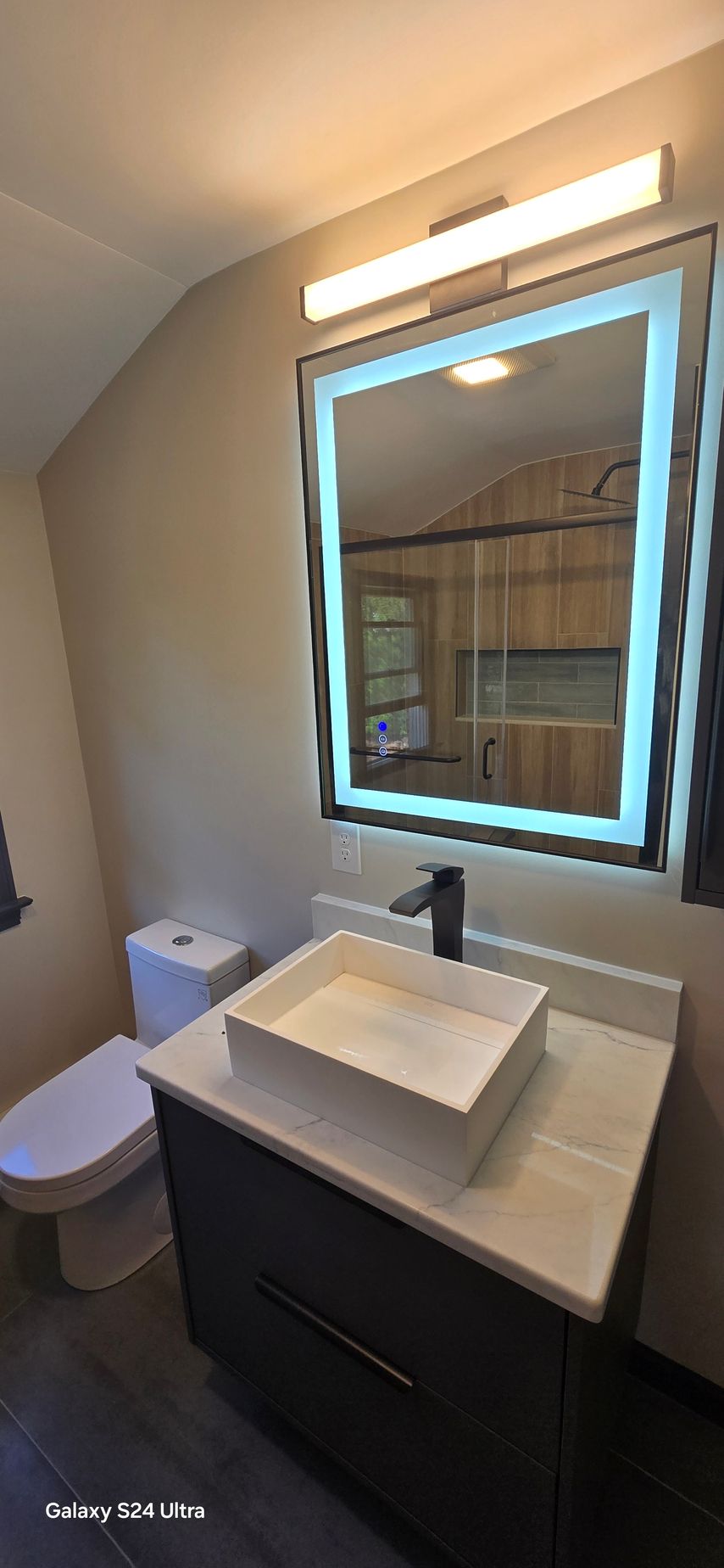 A bathroom with a bathtub and toilet.