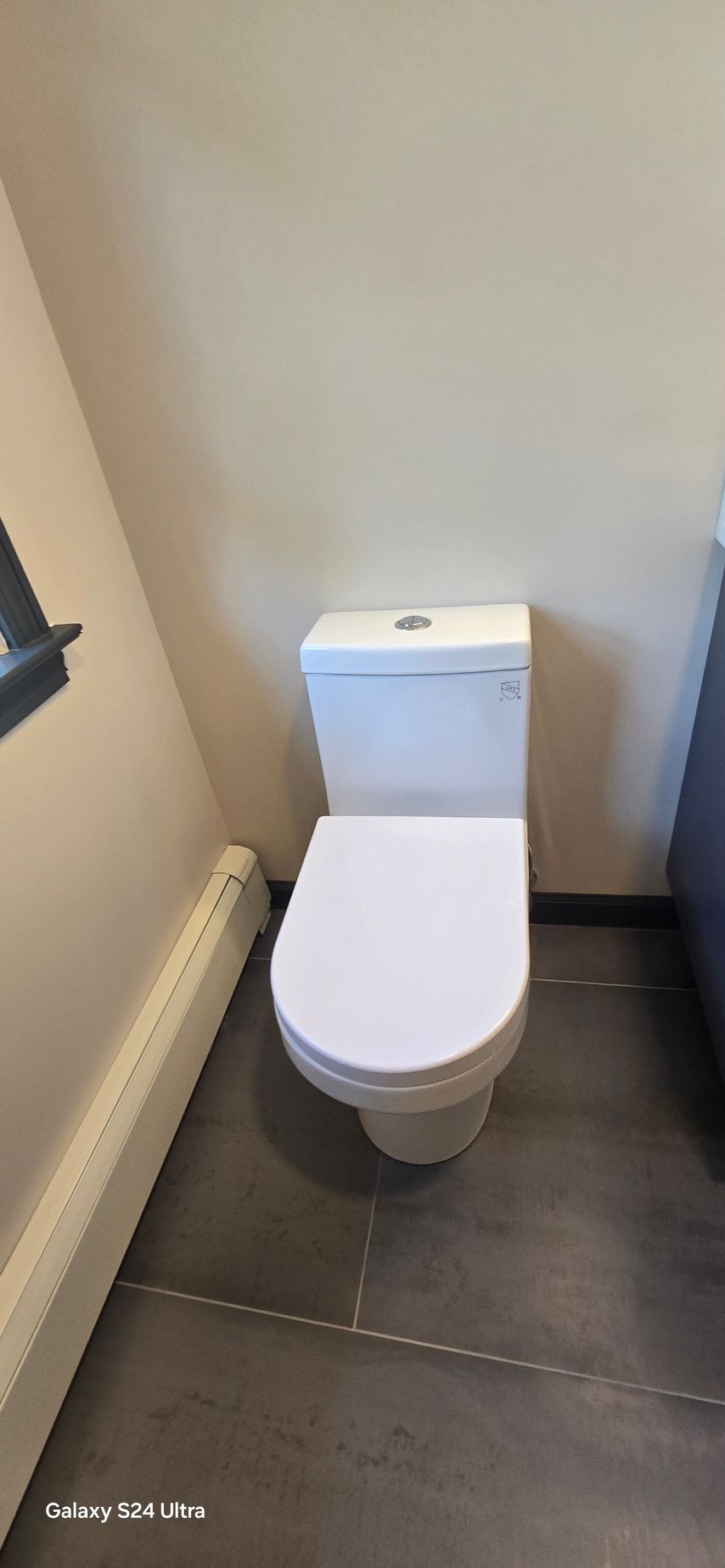 A shower with a bench and a shower head