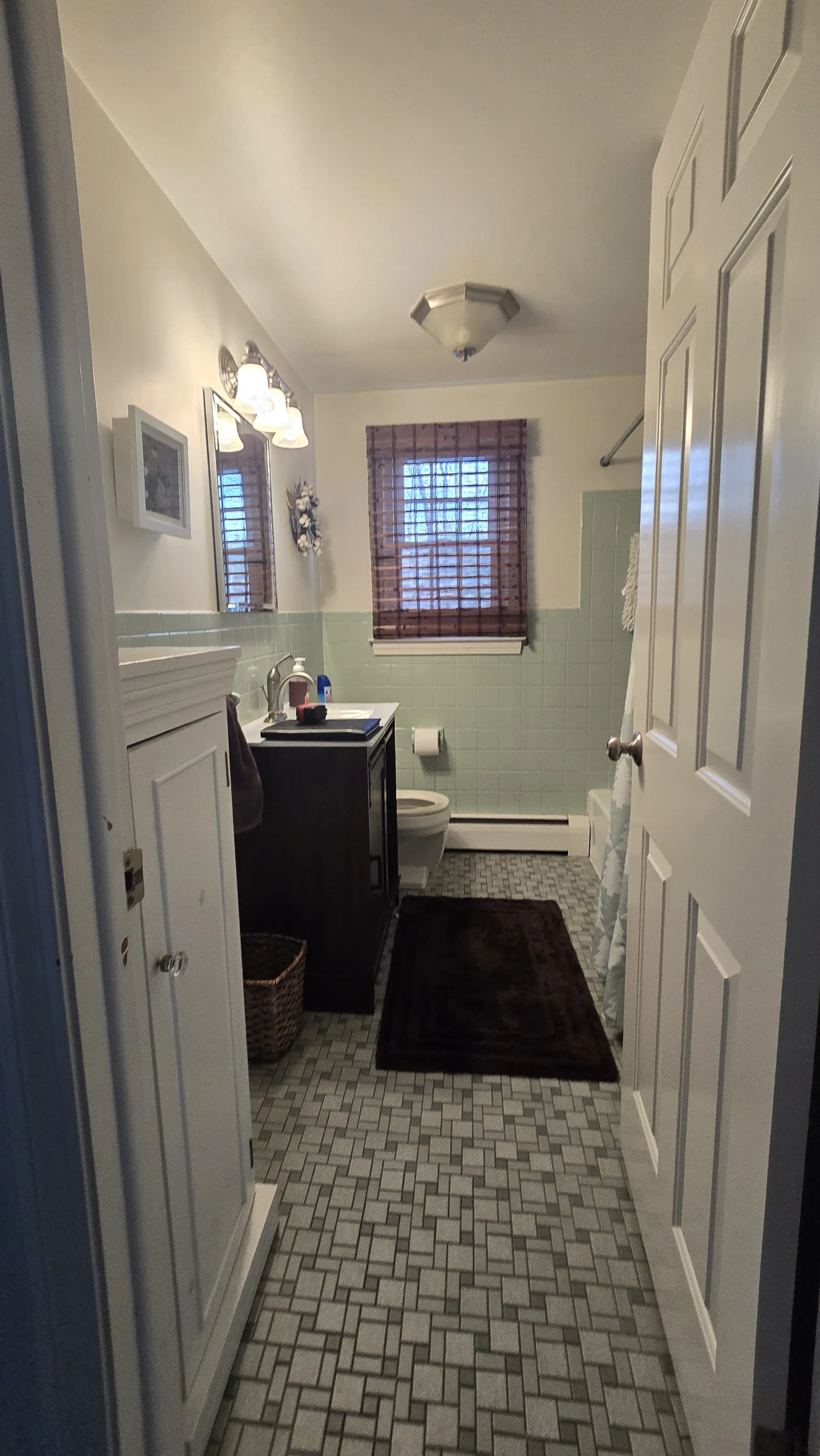 A bathroom with a bathtub and a shower head