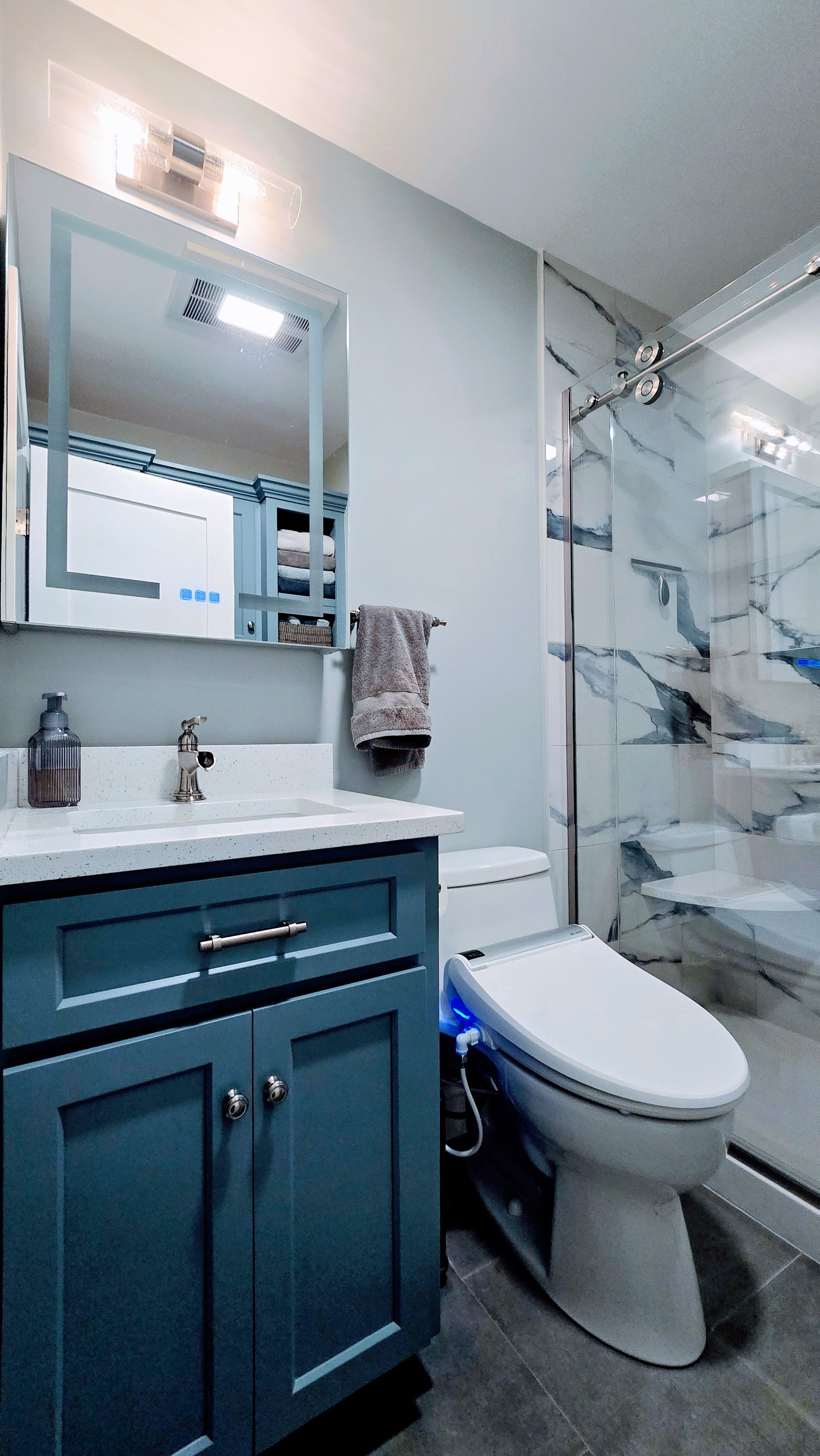 A bathroom with a bathtub and a shower head