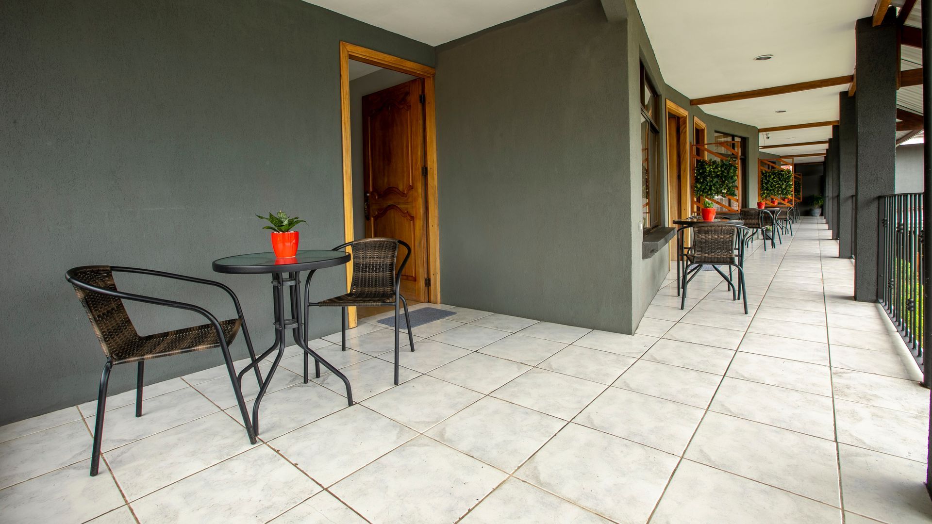 a balcony with a table and chairs in a hotel room .