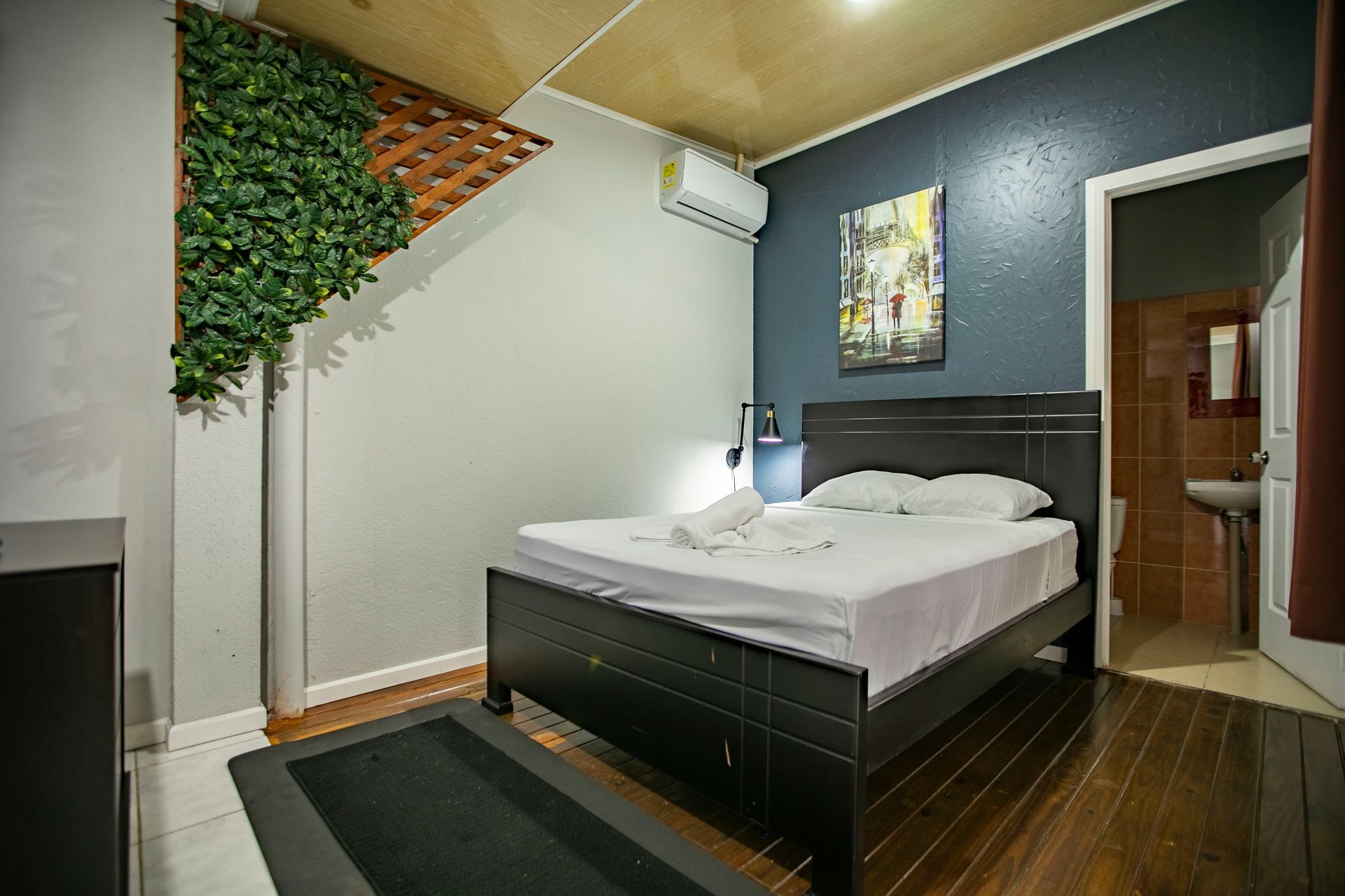 there is a bed in the middle of the room .